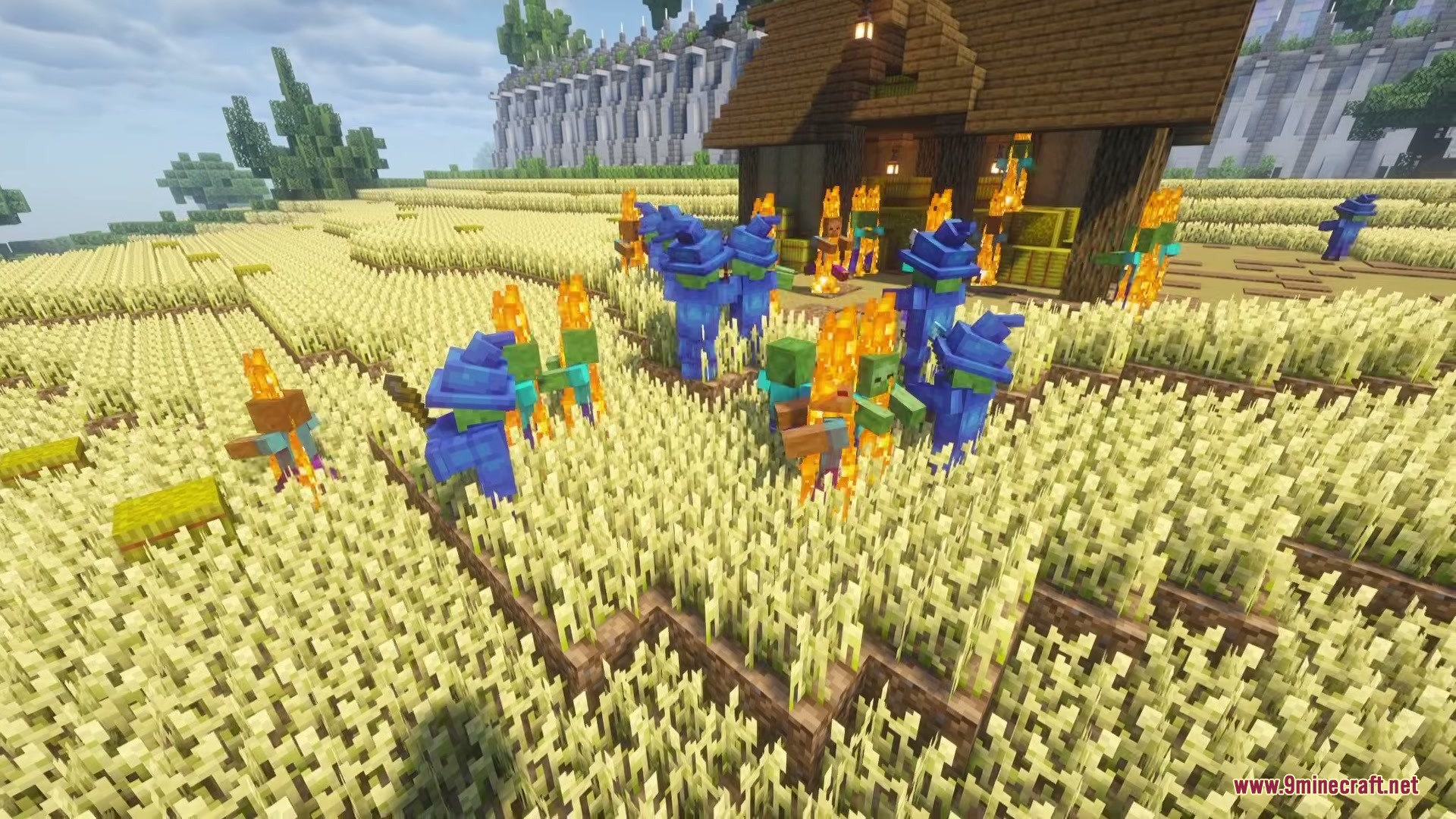 Wizard Mobs Mod Screenshot 9 Zombies wearing blue wizard robes and hats burning in a wheat field