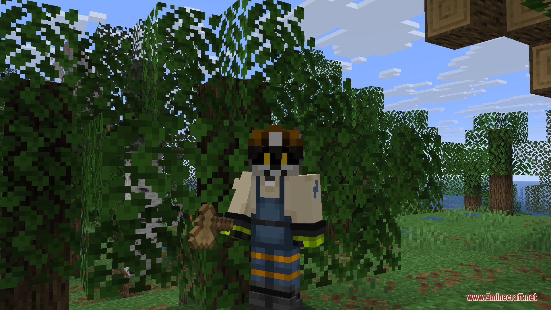 Wooden and Stone Type Tools Resource Pack Screenshot 2 A player character holding a custom wooden axe while standing in a forest