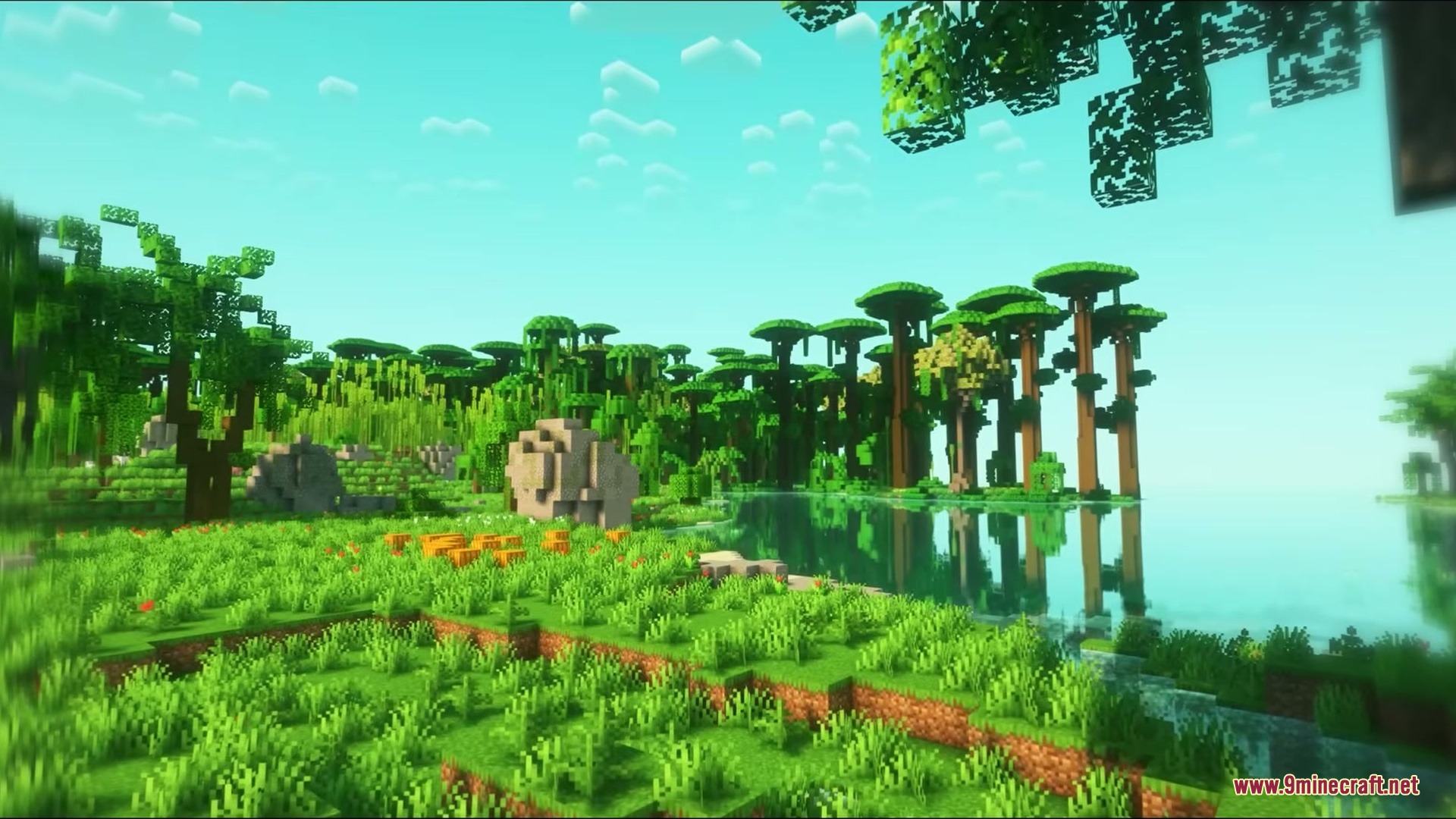 Woodlands the Core Mod Screenshot 11 Beautiful Minecraft landscape with tall custom trees and a peaceful lake reflecting sunlight