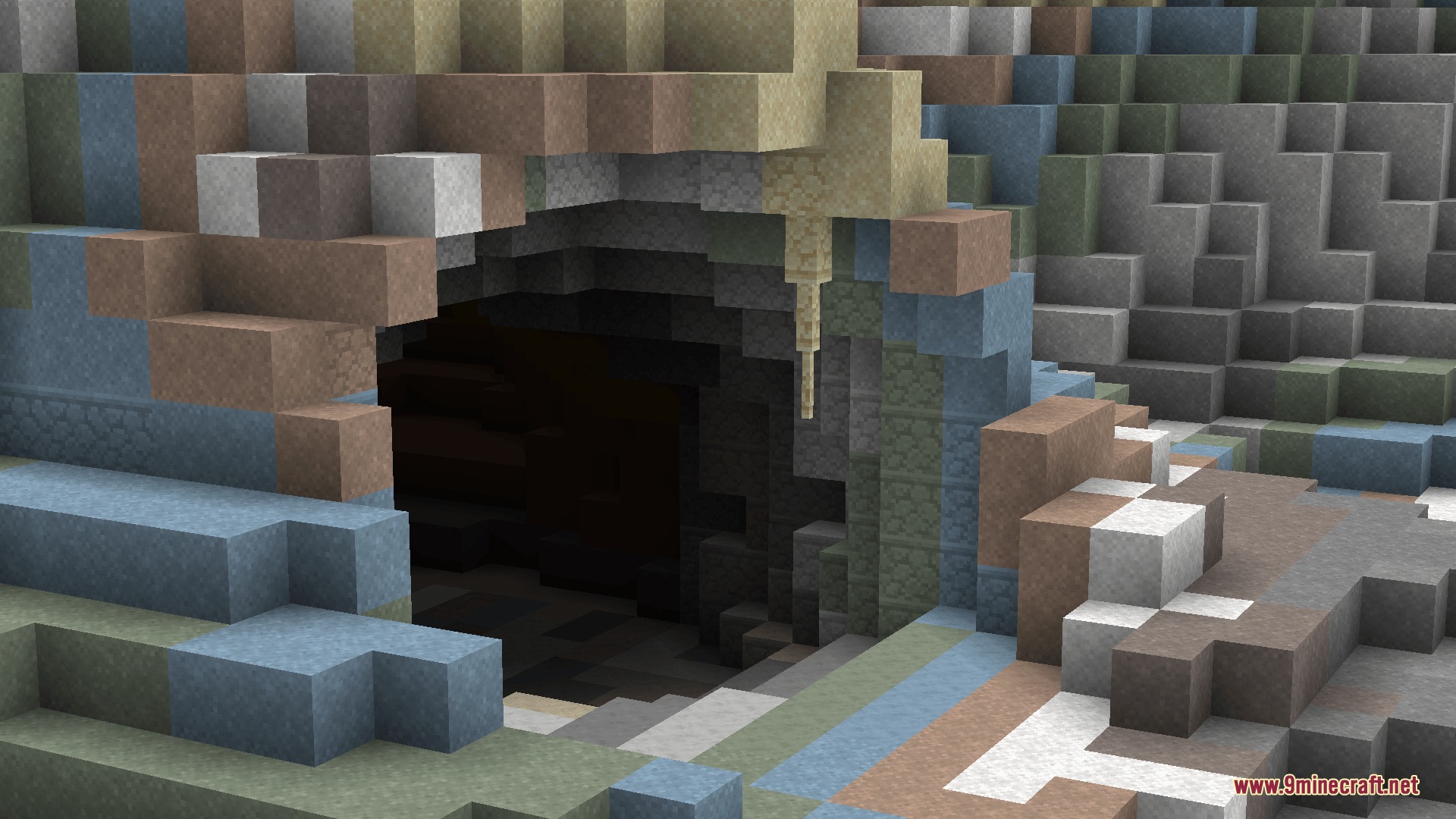 A cave entrance showing realistic geological layers from the World of Stone mod