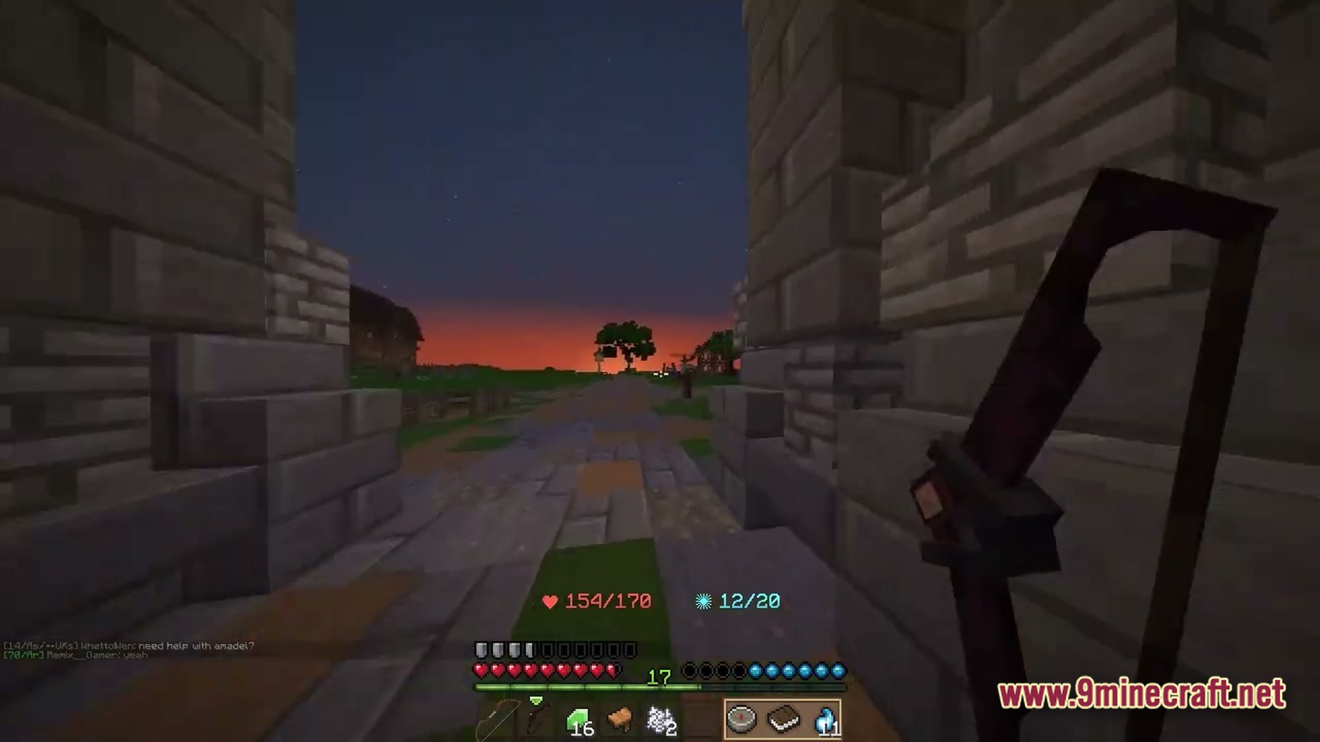 Wynnbound Essentials Modpack Screenshot 1 A first-person view of a player holding a bow while standing between stone brick pillars at sunset