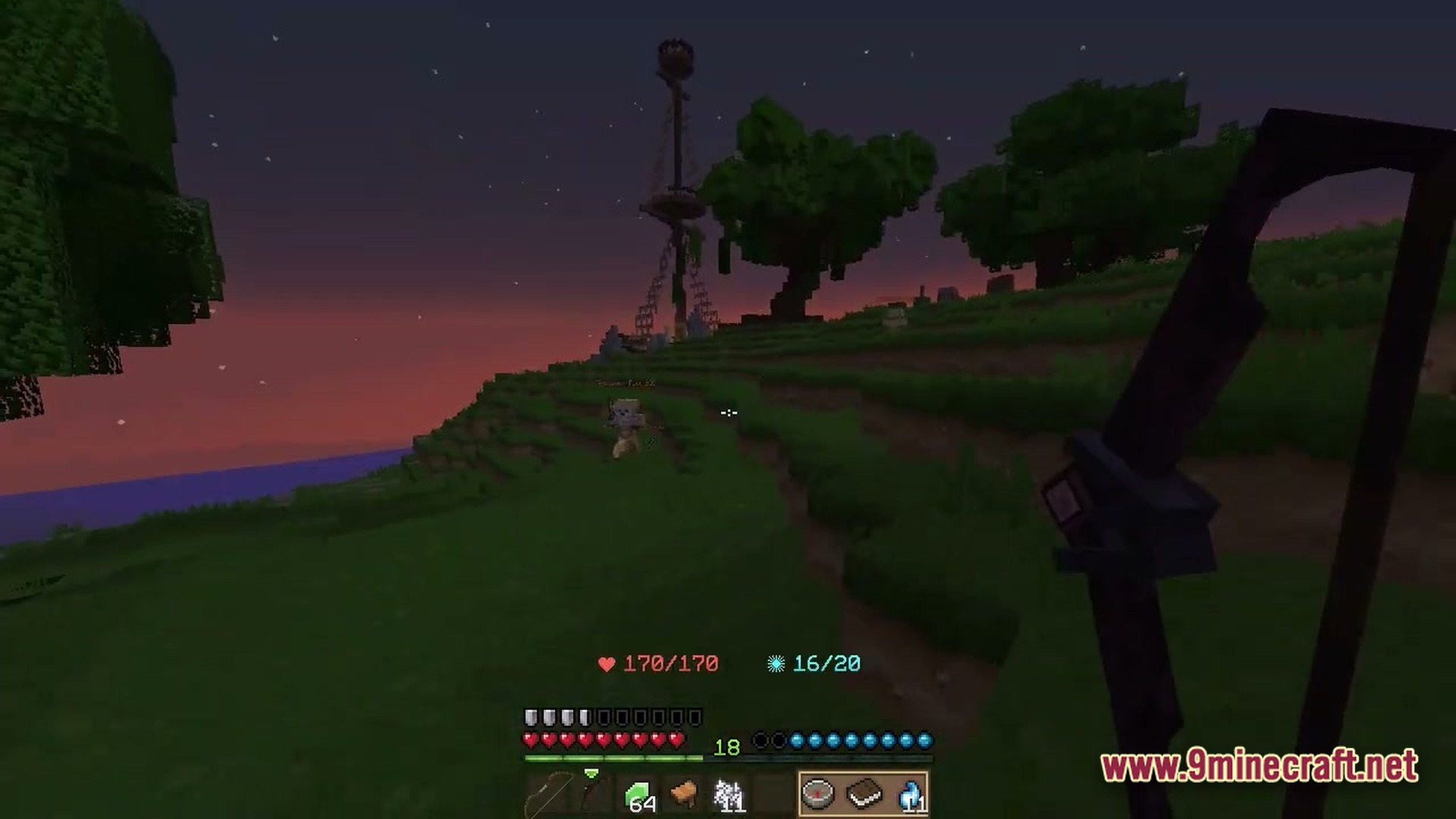 Wynnbound Essentials Modpack Screenshot 3 A player holds a bow while exploring a grassy landscape with custom structures at dusk