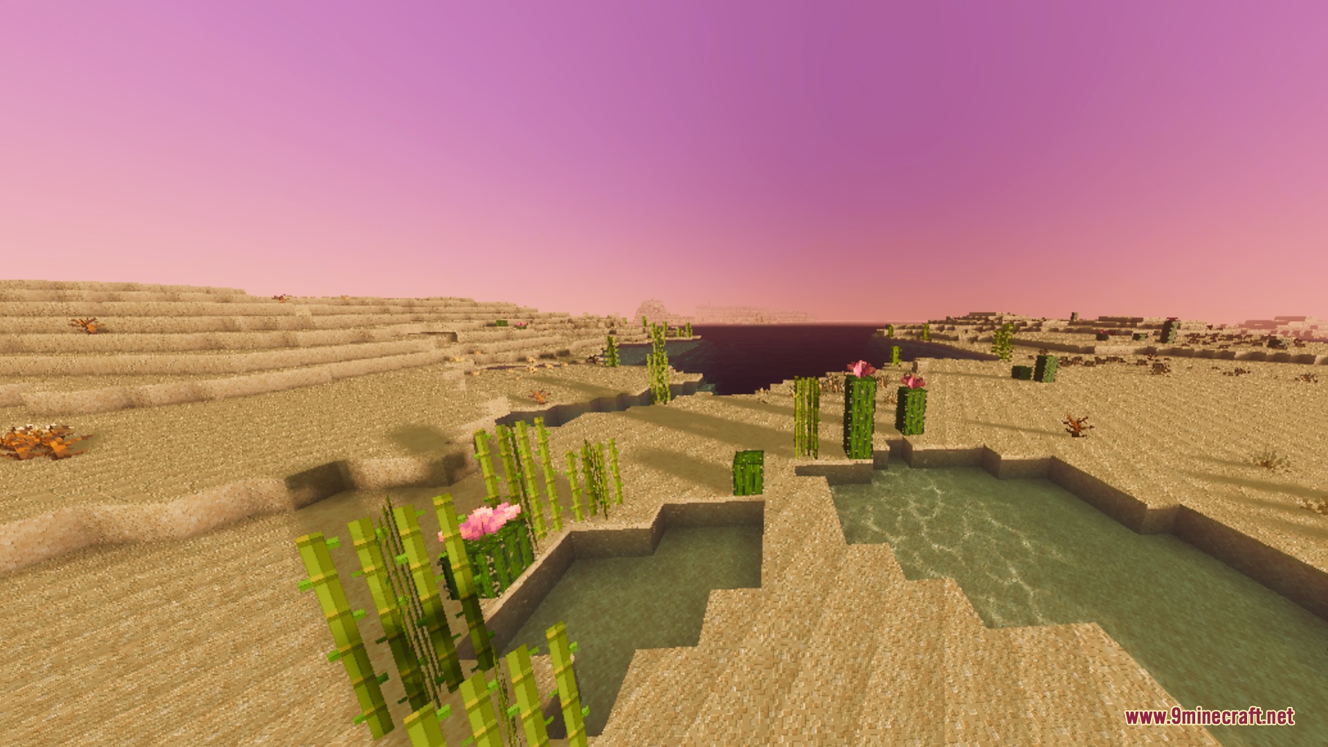 A desert landscape with sand dunes and bamboo under a soft purple sky