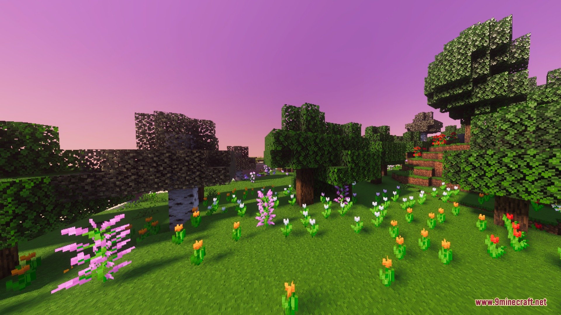 Lush green landscape with colorful flowers and trees under a vibrant pink sky