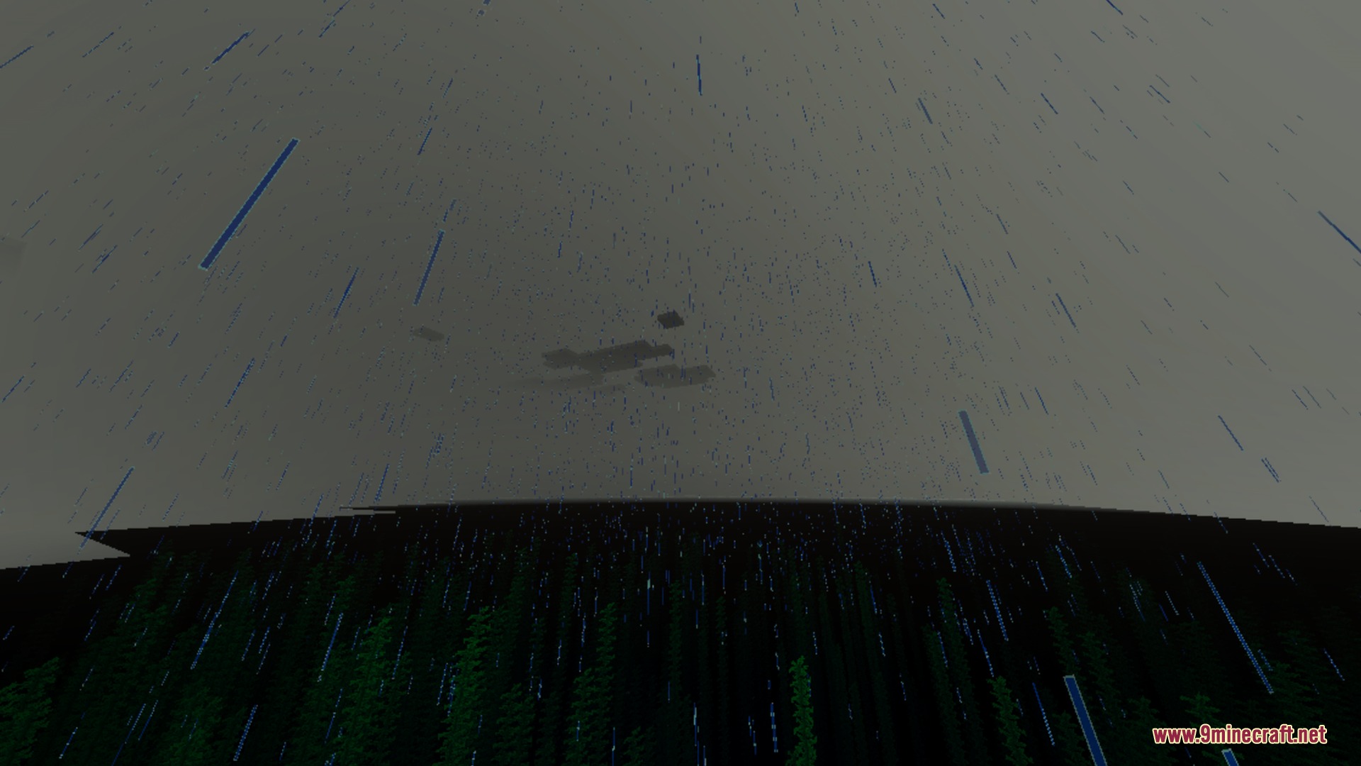 Heavy rain falls over a dark forest under a grey overcast sky
