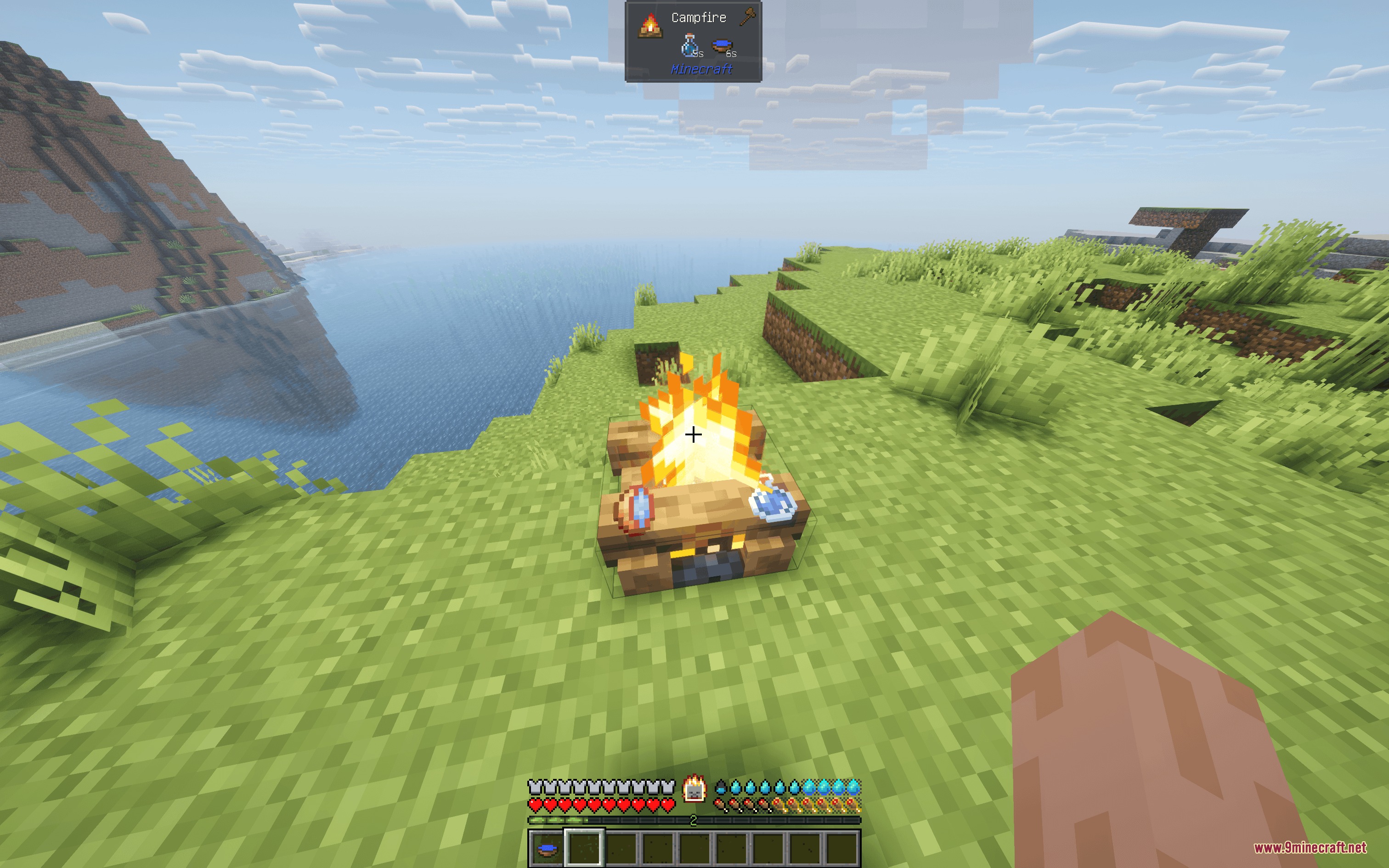 A player cooks water bottles on a campfire to increase their purity
