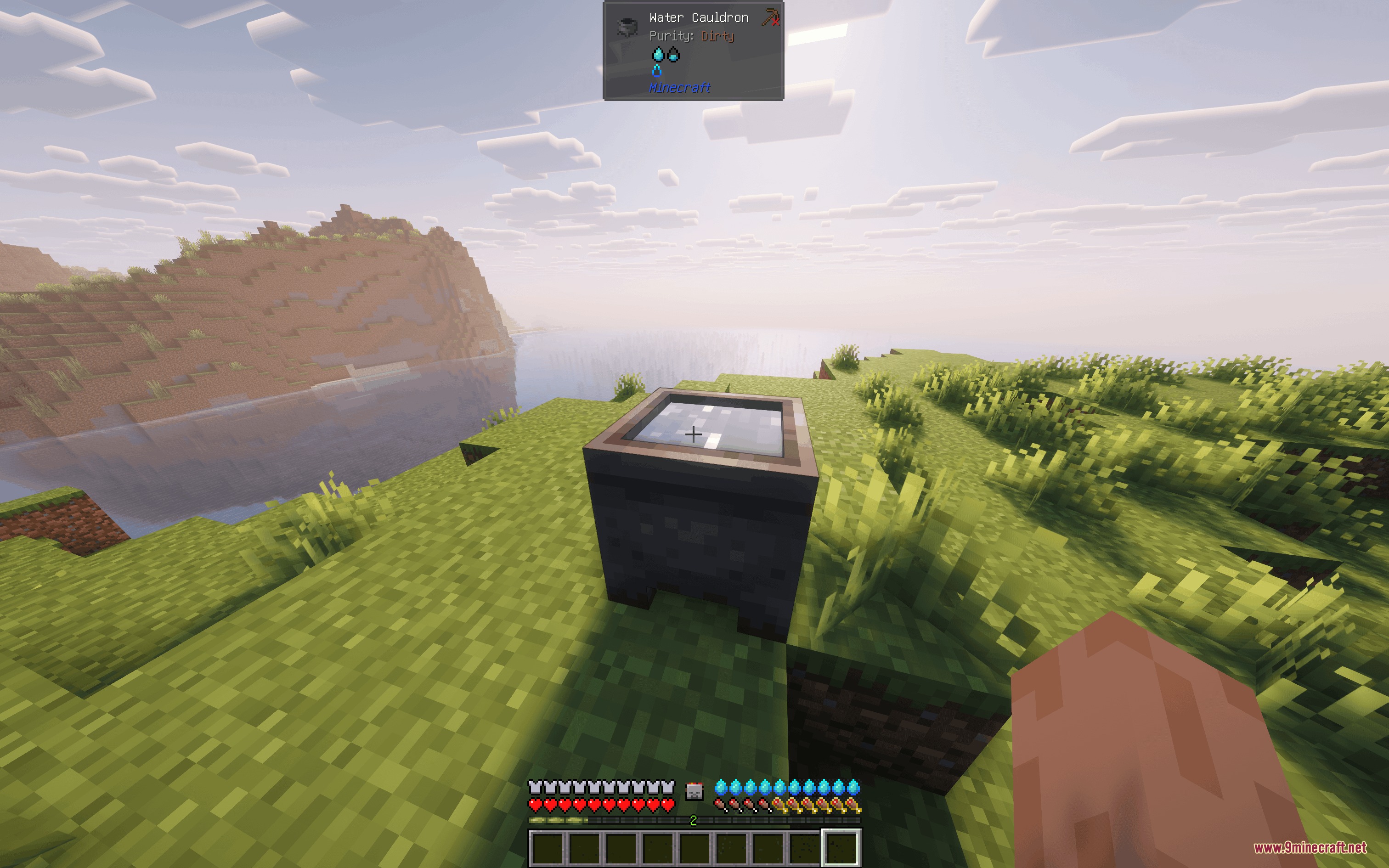 A player looks at a water cauldron with dirty purity in Minecraft
