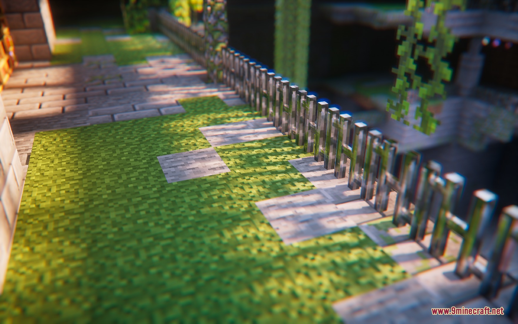 Yitality Resource Pack Screenshot 8 Detailed stone path and grass blocks next to a reflective metal fence