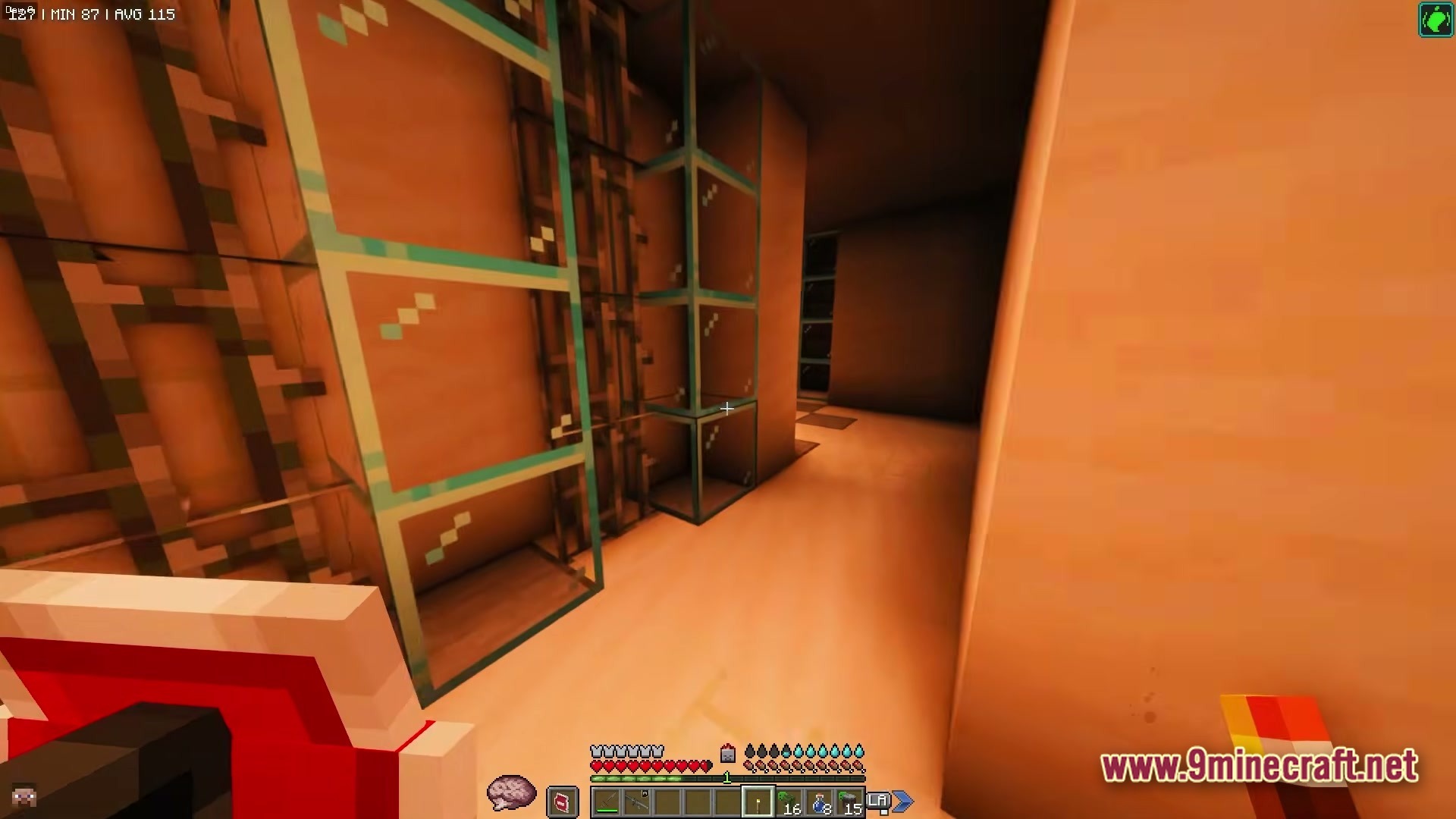 ZOMBIEMANIA A Modern Zombie Apocalypse Modpack Screenshot 1 A player explores a dimly lit interior hallway featuring glass blocks and industrial metal scaffolding