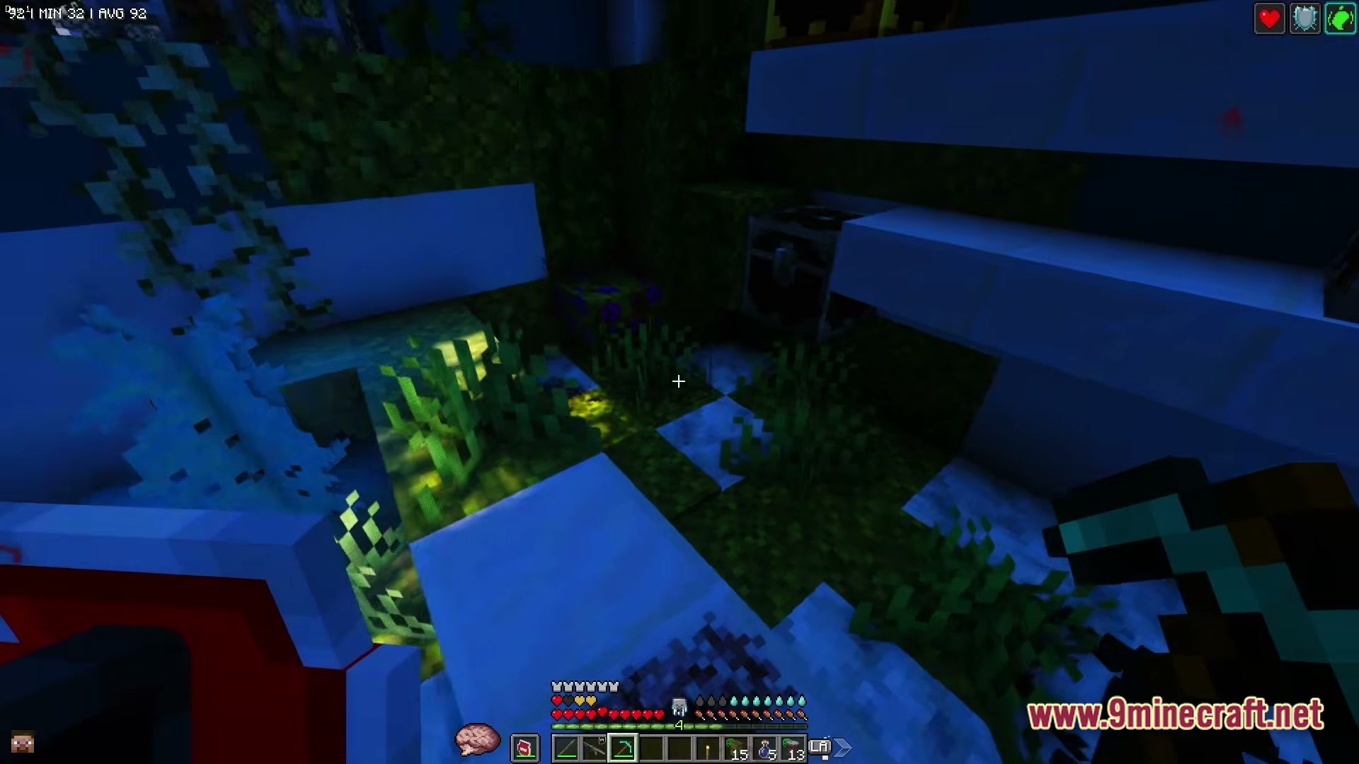 ZOMBIEMANIA A Modern Zombie Apocalypse Modpack Screenshot 3 A first-person view of a player holding a pickaxe in a dark, overgrown underground structure