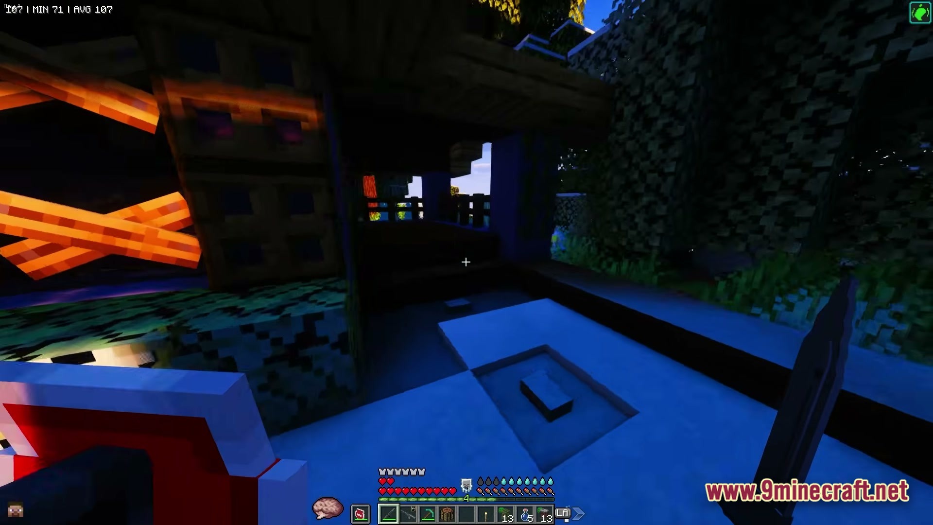 ZOMBIEMANIA A Modern Zombie Apocalypse Modpack Screenshot 4 A first-person view of a player holding a knife near a barricaded wooden structure at night