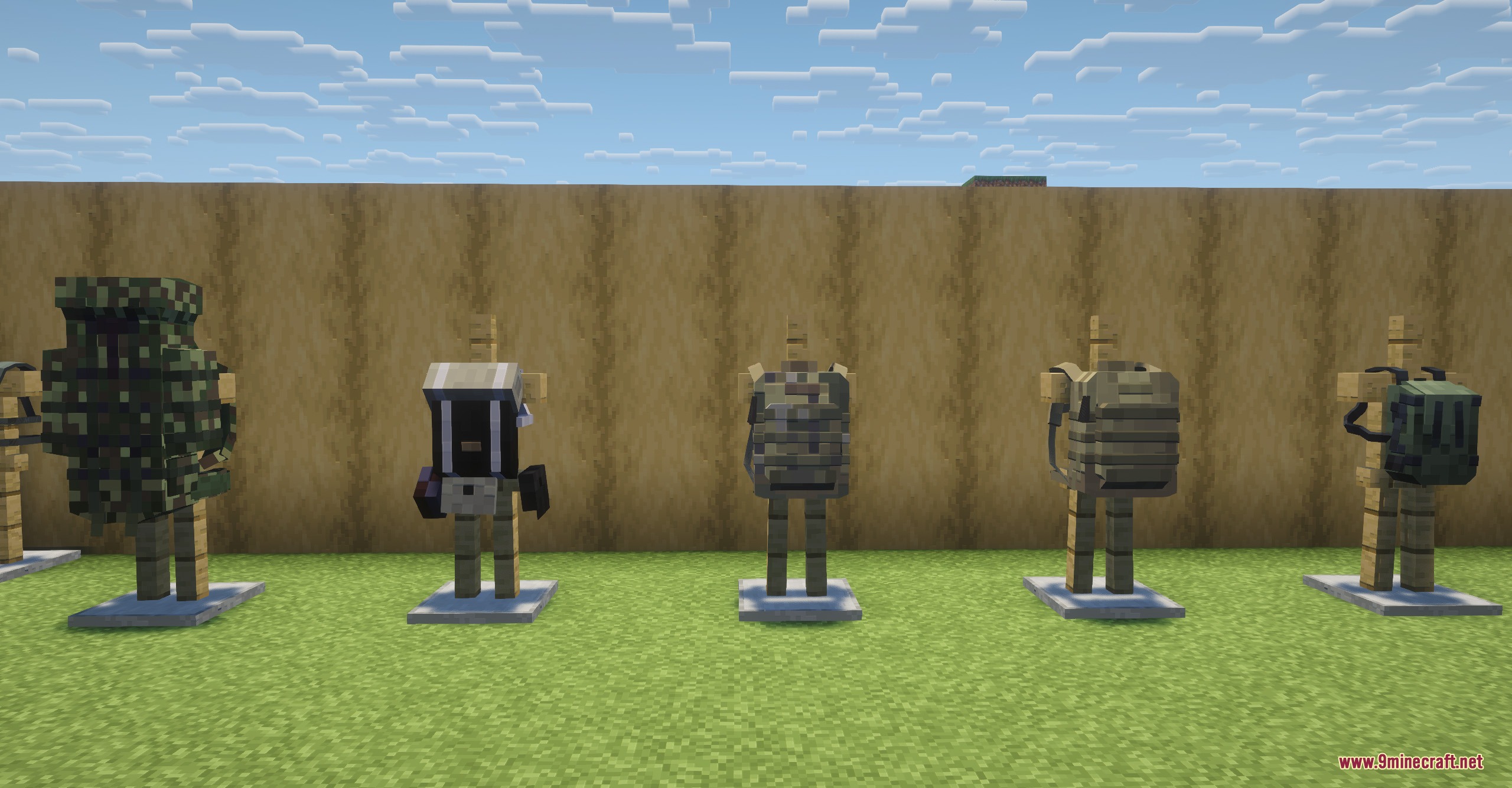 Armor stands displaying a variety of tactical backpacks and military vests