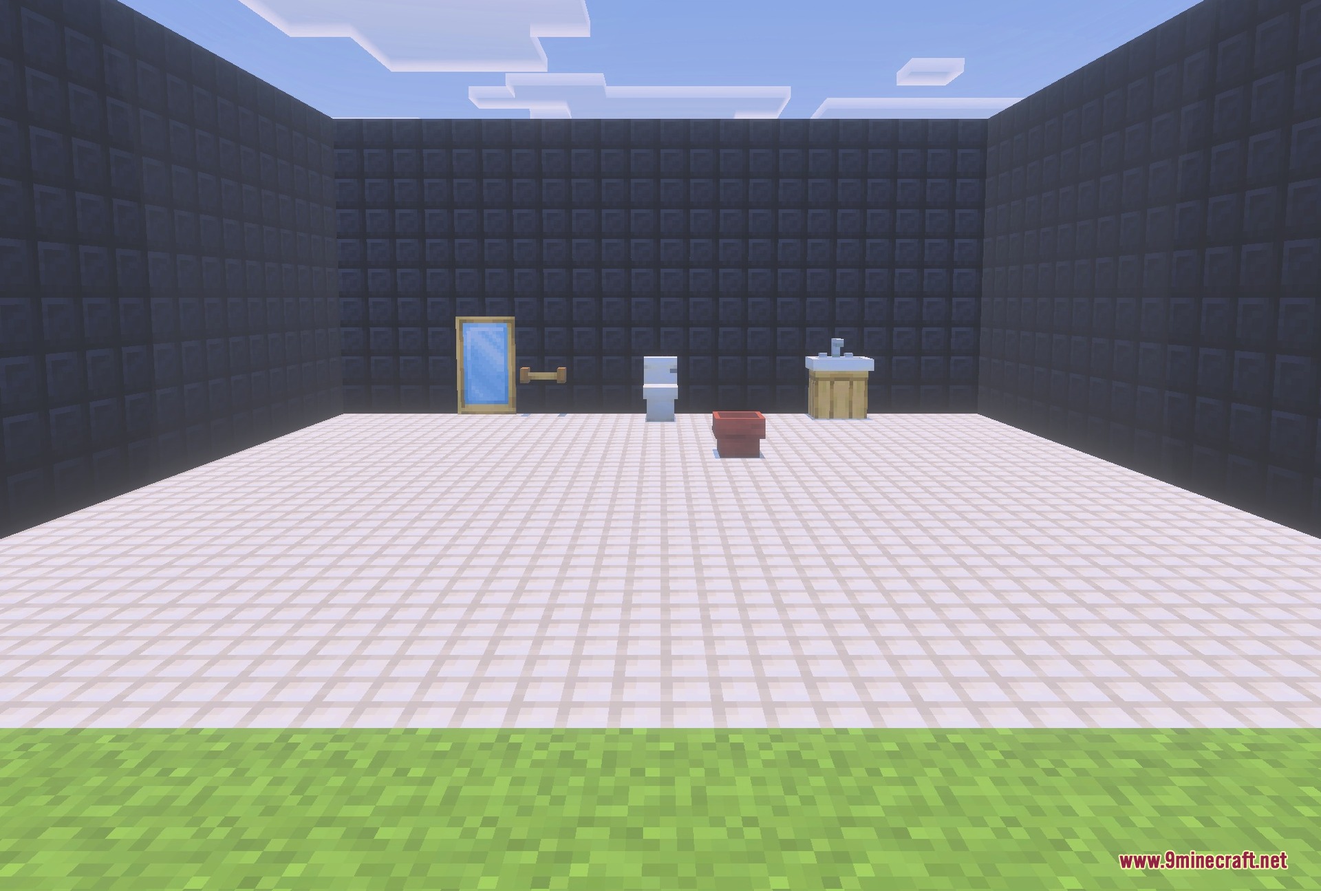 A bathroom with the sink cabinet, toilet and mirror