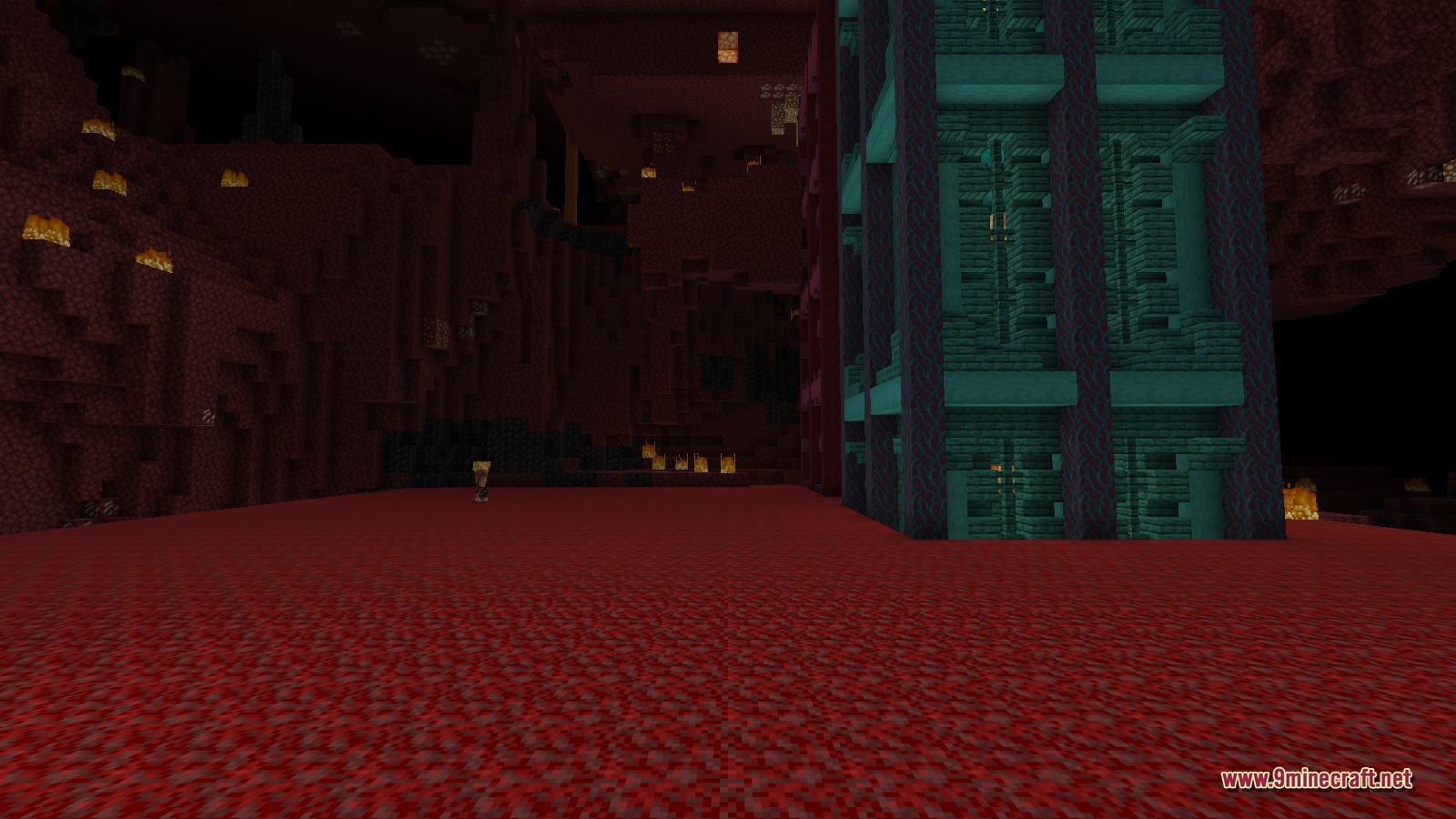 A tall Warped Tower built from teal warped materials standing in an open Nether cave, with fire and netherrack terrain around it