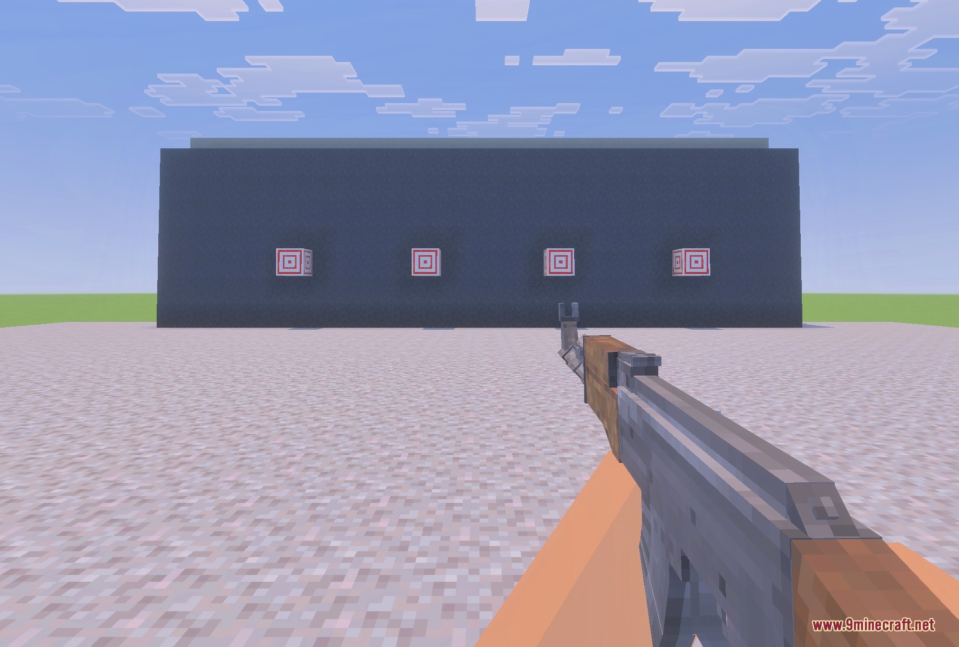 Holding the AK-47 at a concrete shooting range