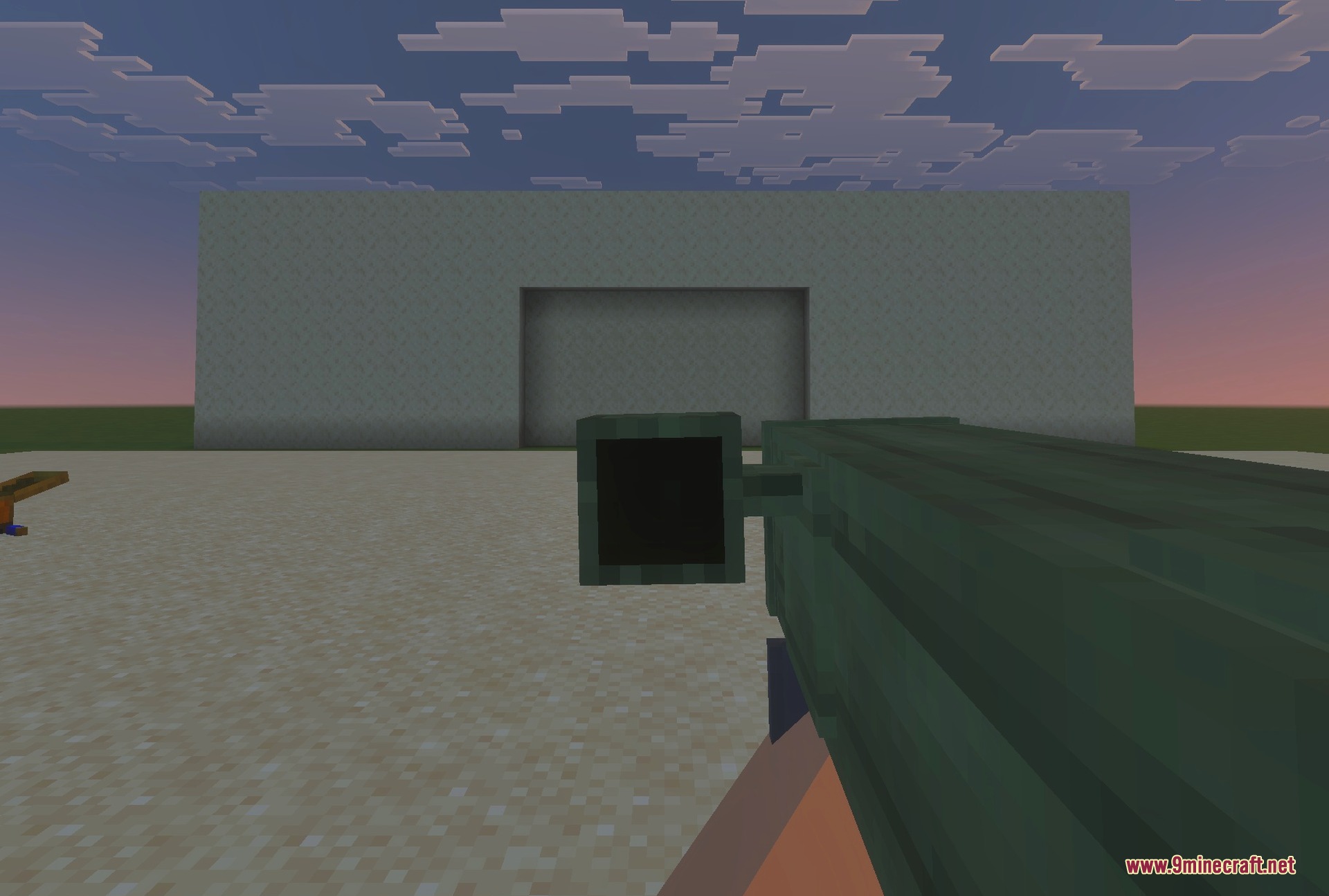 The M202 rocket launcher in front of a desert bunker