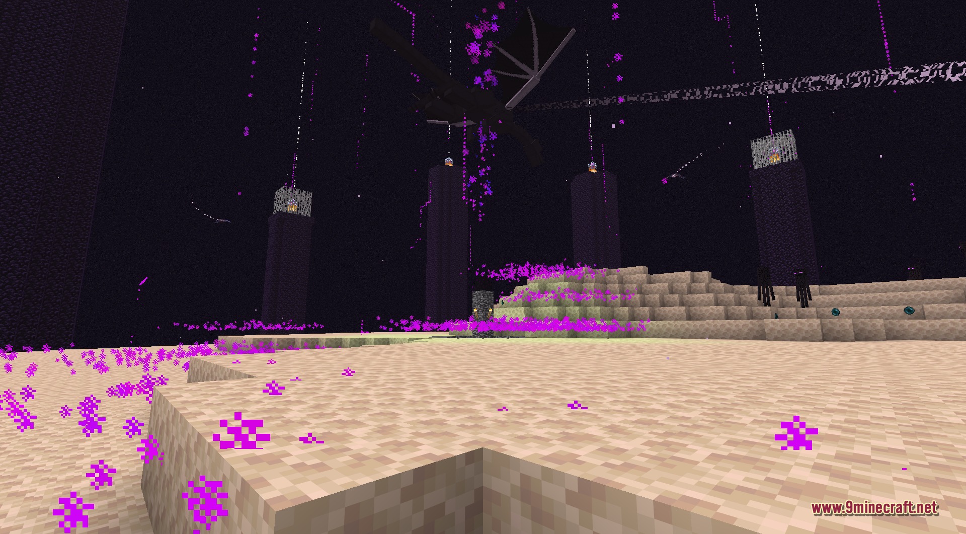 The overhauled Ender Dragon in flight above the End island, seen from a low dramatic angle, with the obsidian pillars and their end crystals below and sweeping streams of energy from its laser attack crossing the sky
