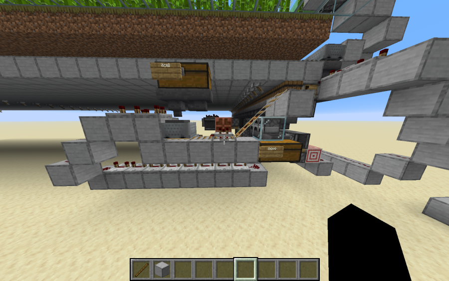 Detailed view of redstone circuits and minecart tracks for the automated smelting system
