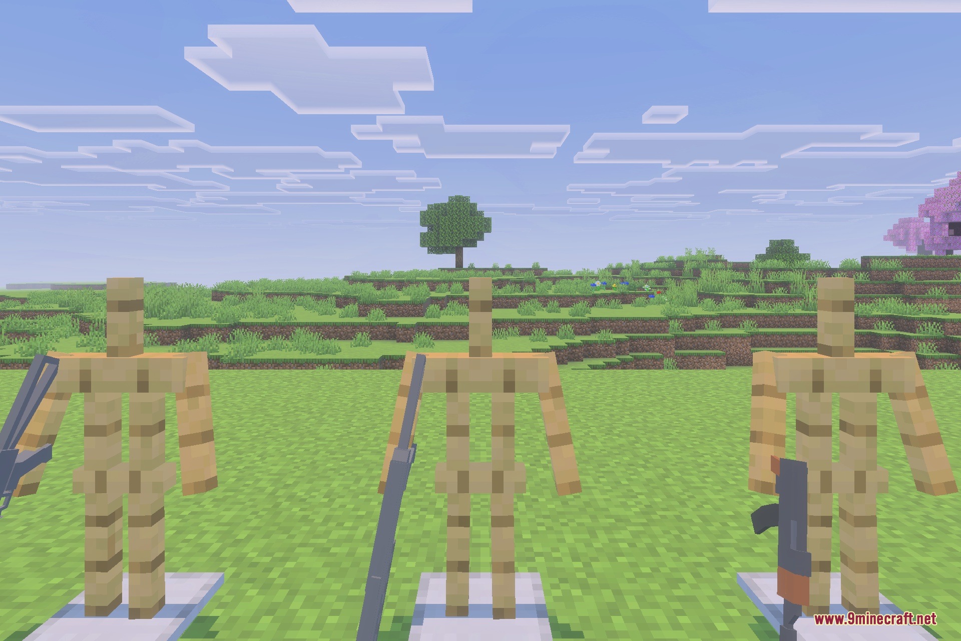 Three wooden armor stands holding different 3D guns in a Minecraft world