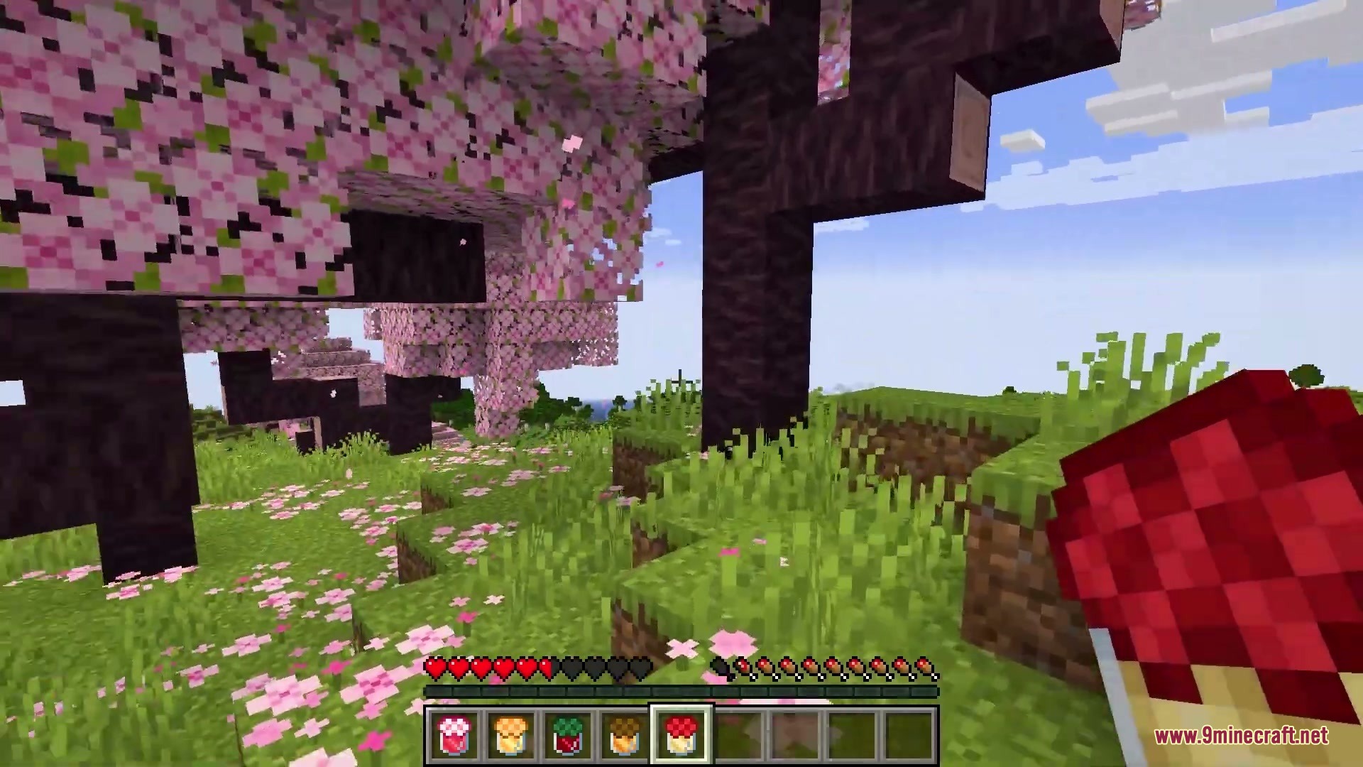 Abundant Harvest Table Mod Screenshot 7 A player holds a red jam jar while standing in a cherry grove