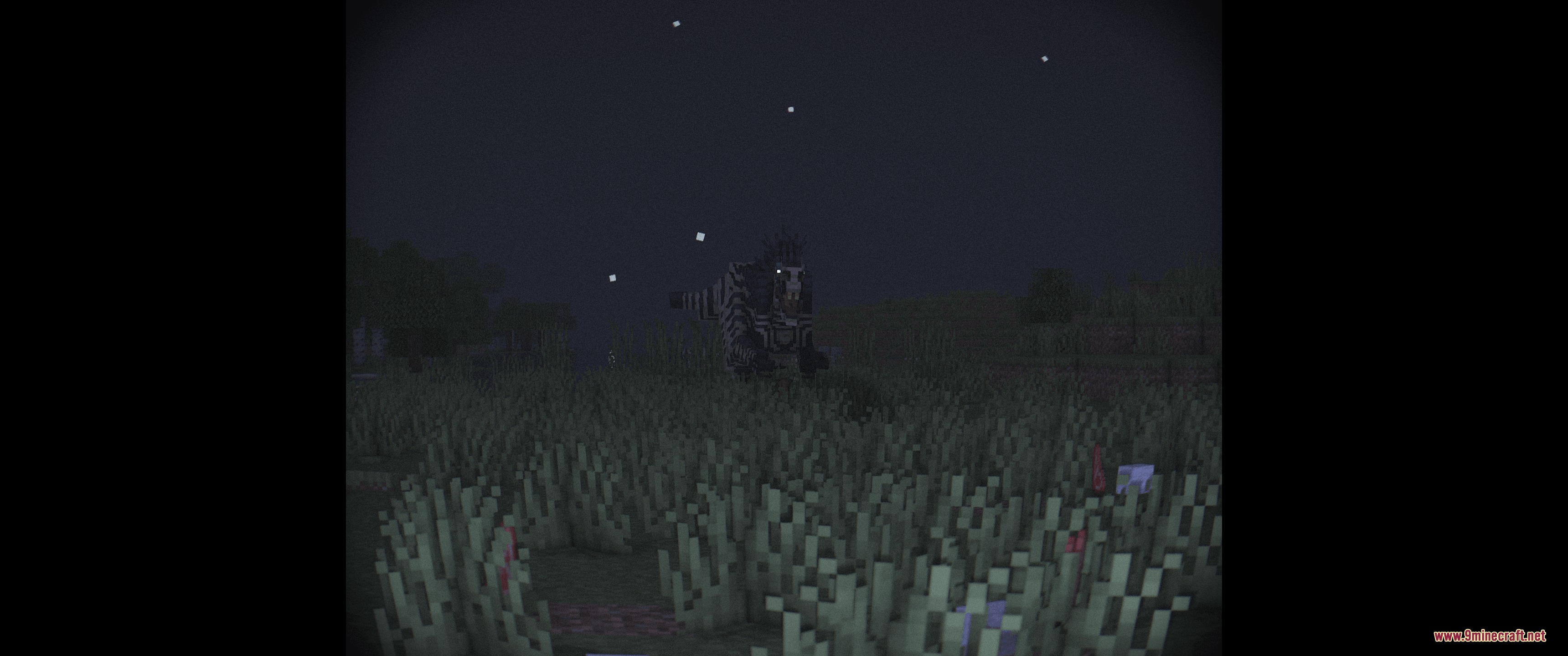 A striped Megaraptor standing in tall grass under a dark starry sky