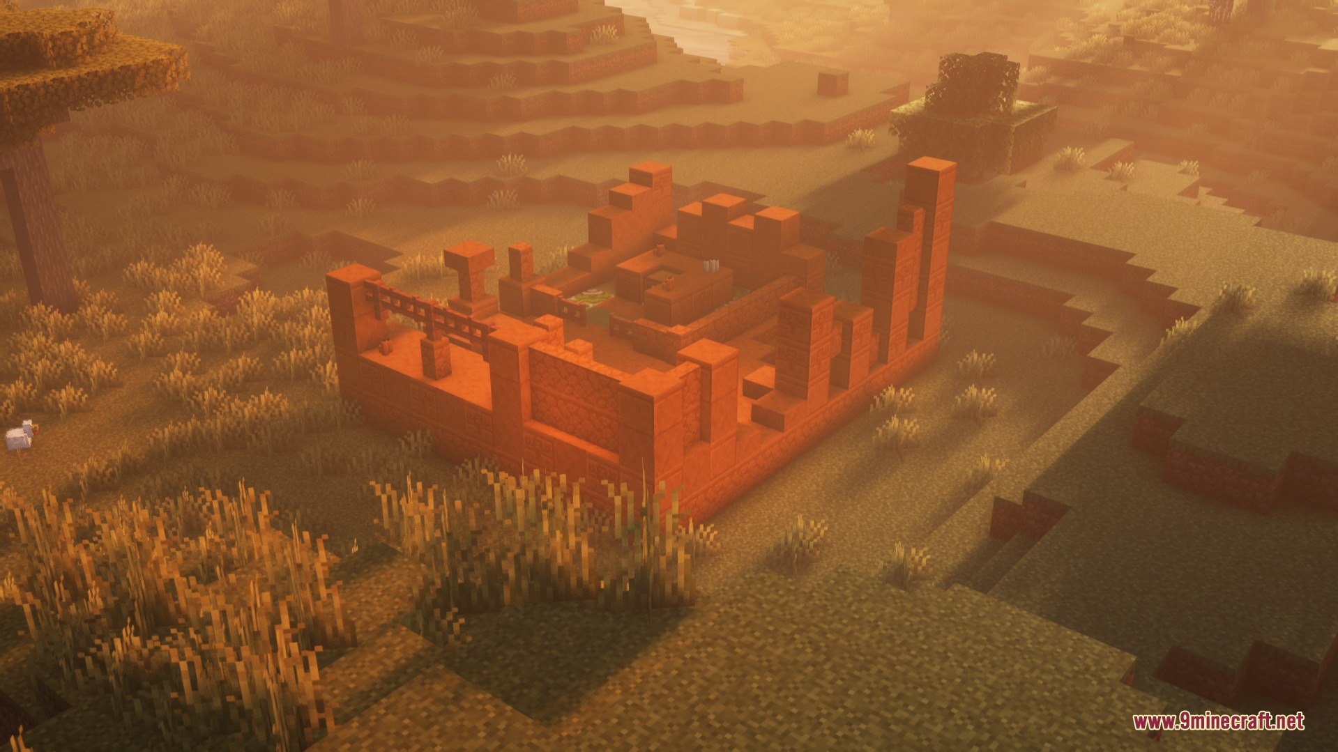Ancient Domain Sprawl Mod Screenshot 6 Red sandstone ruins standing in a savanna biome during a golden sunset