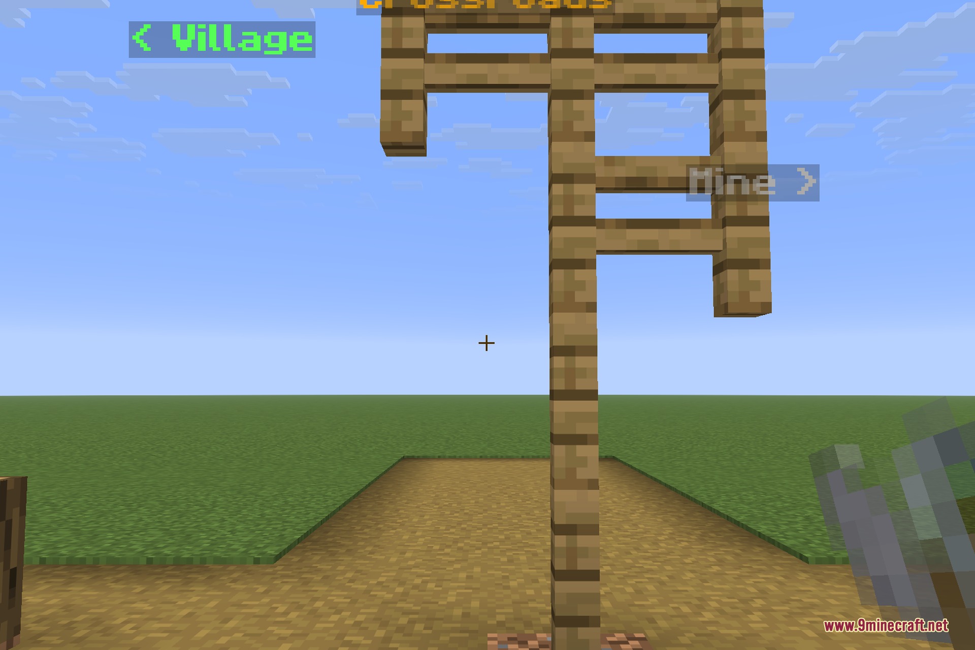 A signpost at a crossroads with three labels pointing different ways