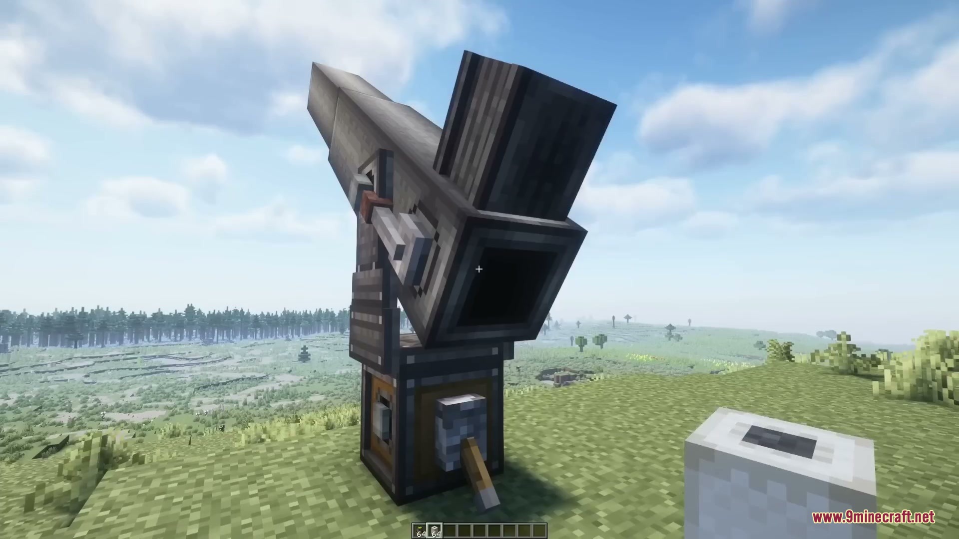 Atomic Casing Project Mod Screenshot 5 A large mechanical cannon stands ready for action on a grassy hill