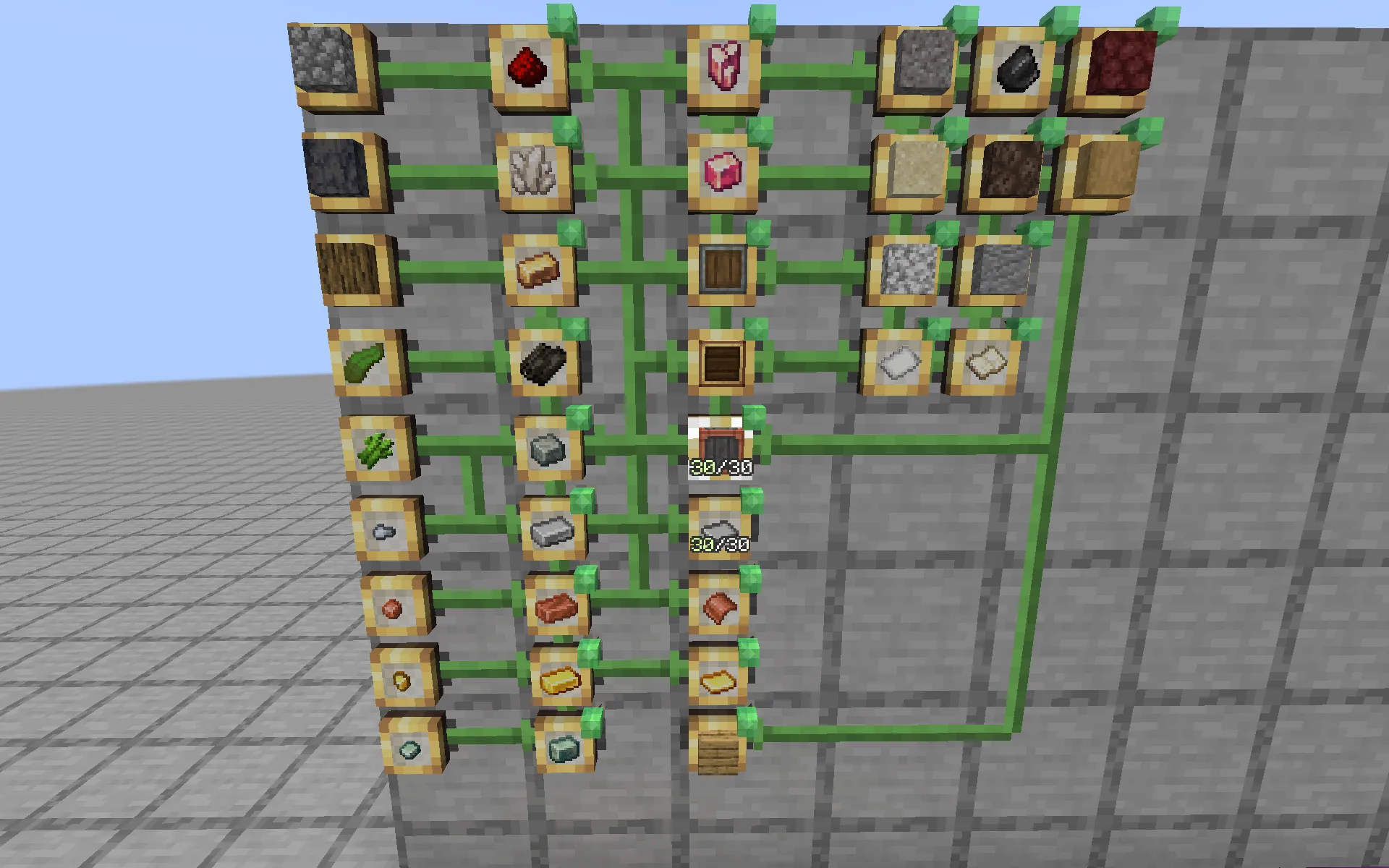 Item frames on a wall showing complex crafting trees and resource paths