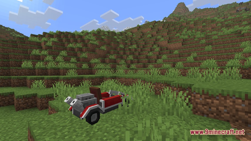 Automobility 9minecraft Mod Screenshot 1 Custom red motorcar parked on a grassy hill in Minecraft
