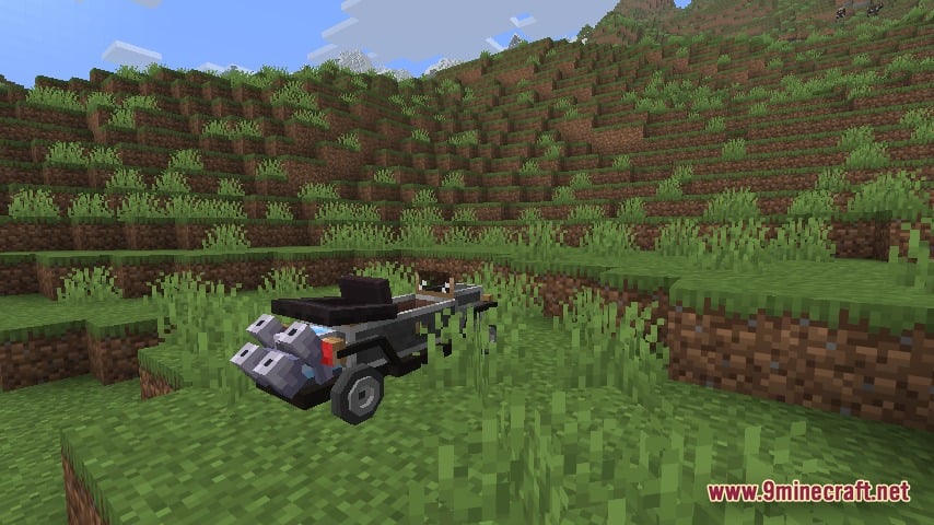 Automobility 9minecraft Mod Screenshot 3 A grey motorcar with large wheels parked on a grassy Minecraft hill
