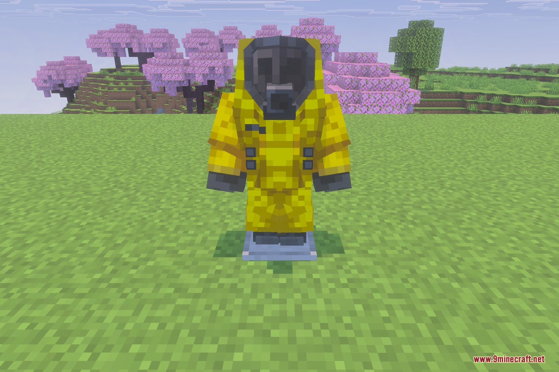 A player wearing a protective yellow hazmat suit stands in a cherry blossom forest