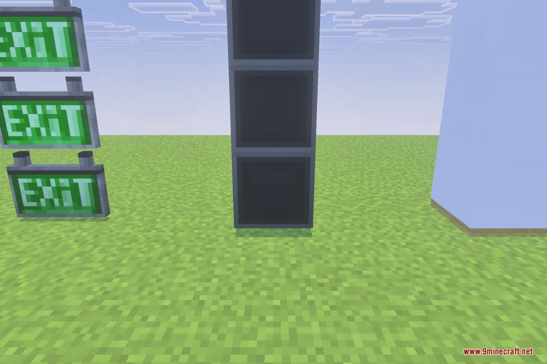 Three glowing green exit signs stacked vertically next to dark blocks
