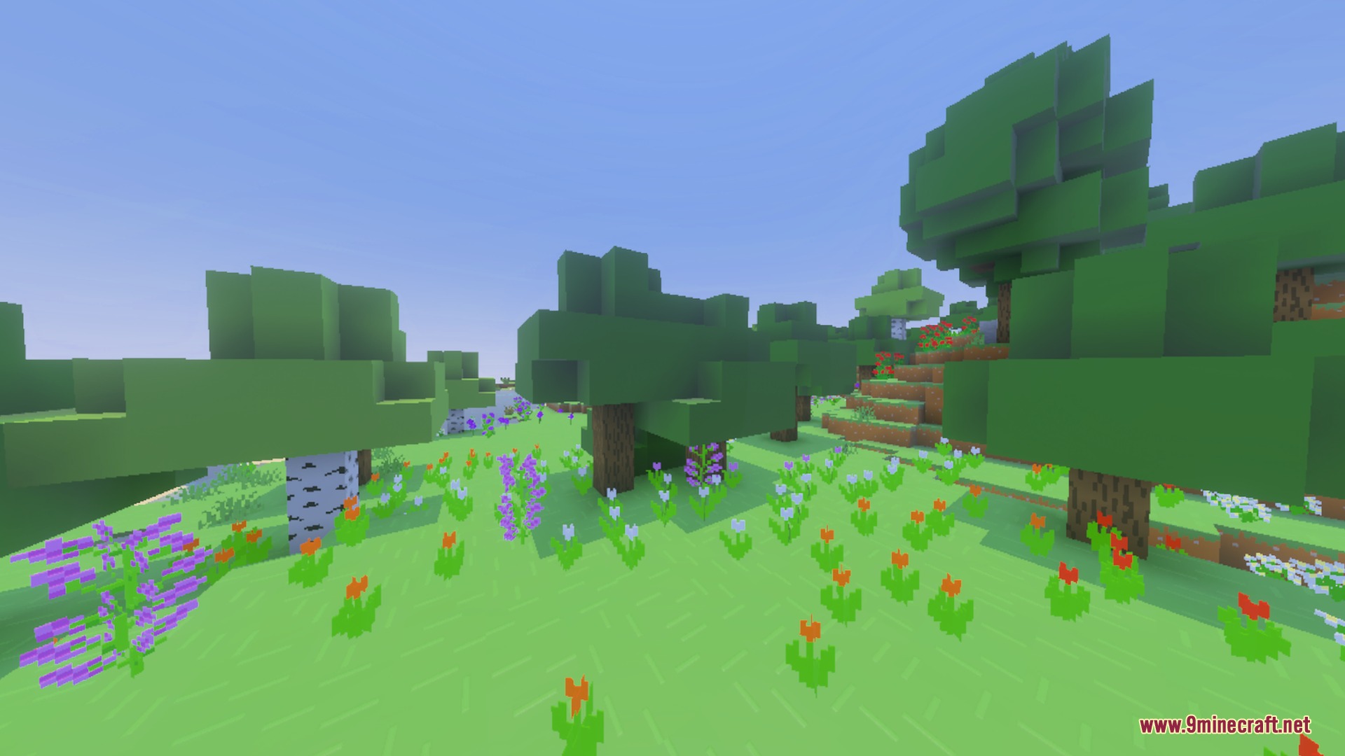 BBSPBRBP Lite Shader Screenshot 9 A vibrant flower meadow with stylized trees under a clear blue sky