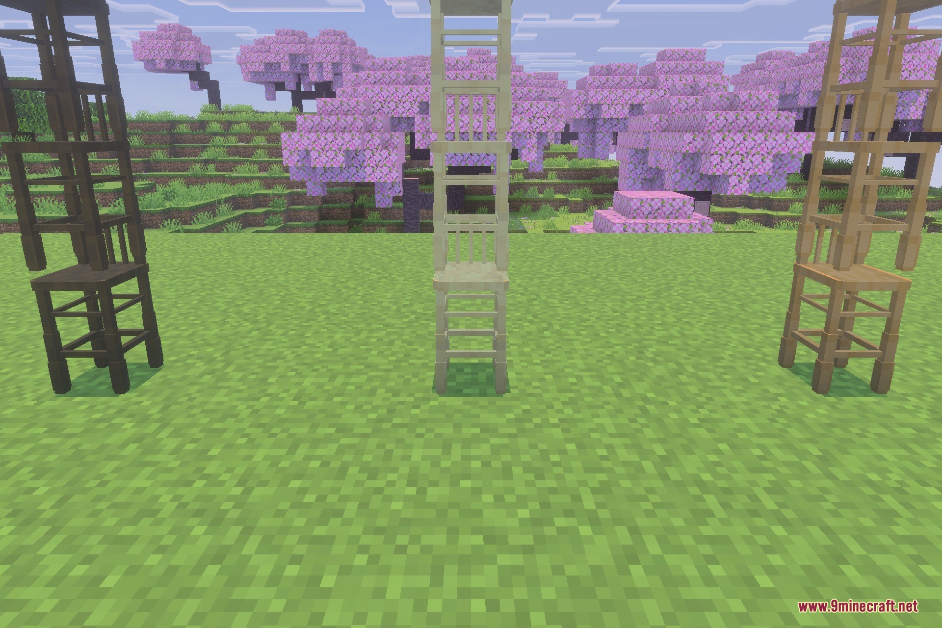 Three wooden barstools in different wood types with cherry blossom trees behind