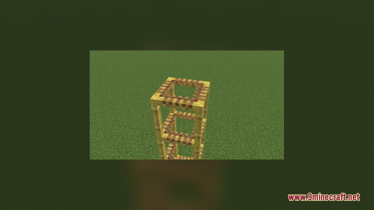 A tall tower of scaffolding blocks with transparent centers on green grass