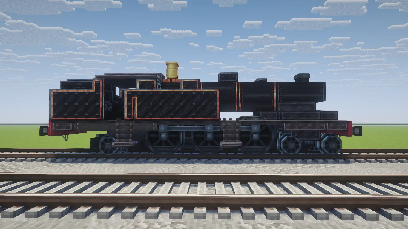A side profile of a black steam locomotive resting on a railway track