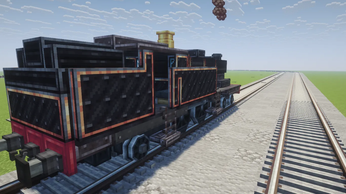A detailed black steam locomotive with red accents on a railway track