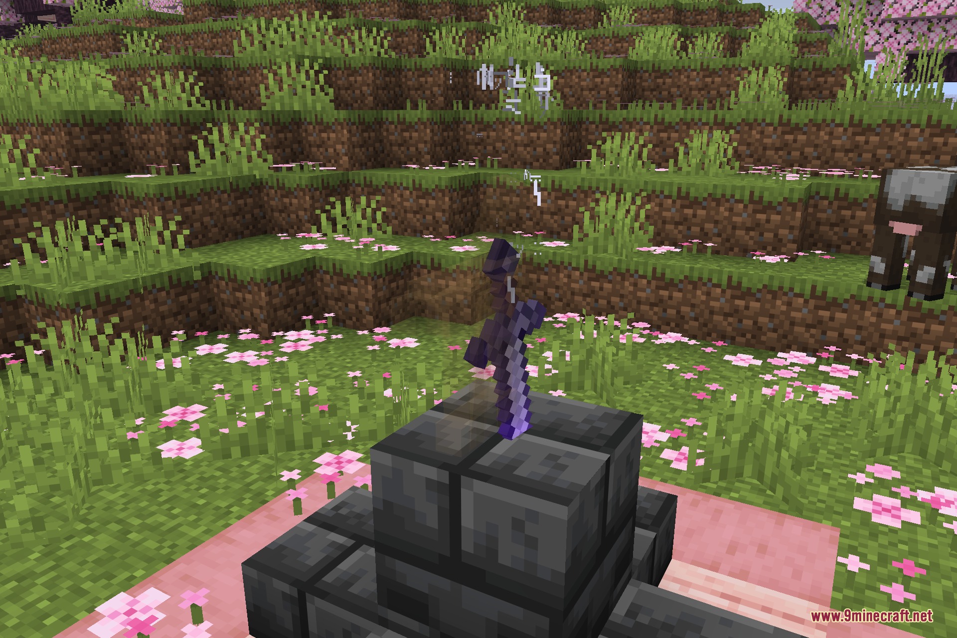 An enchanted sword stuck in a chiseled deepslate pedestal in a cherry grove