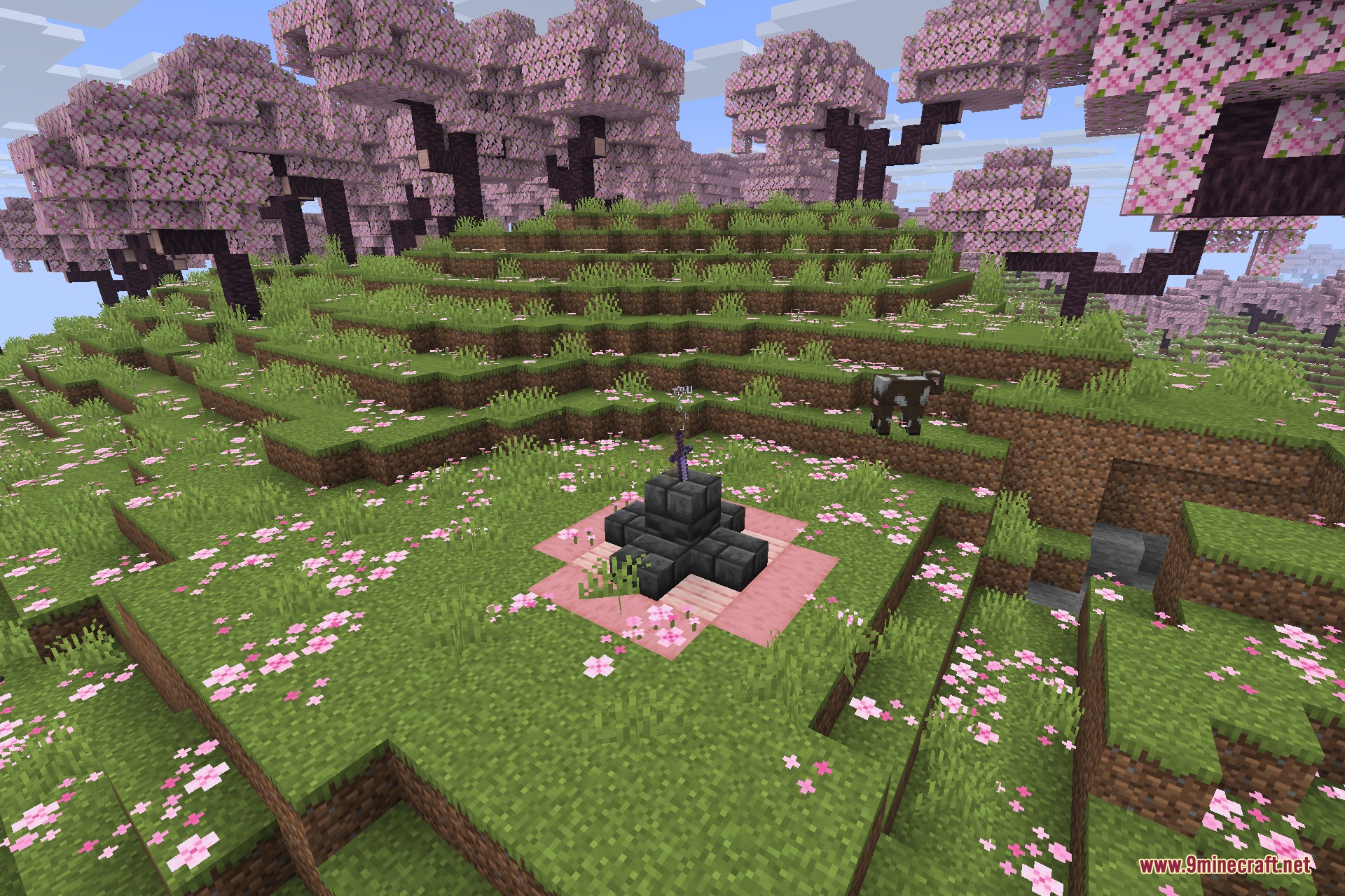 A stone pedestal holding a sword on a pink platform among cherry trees