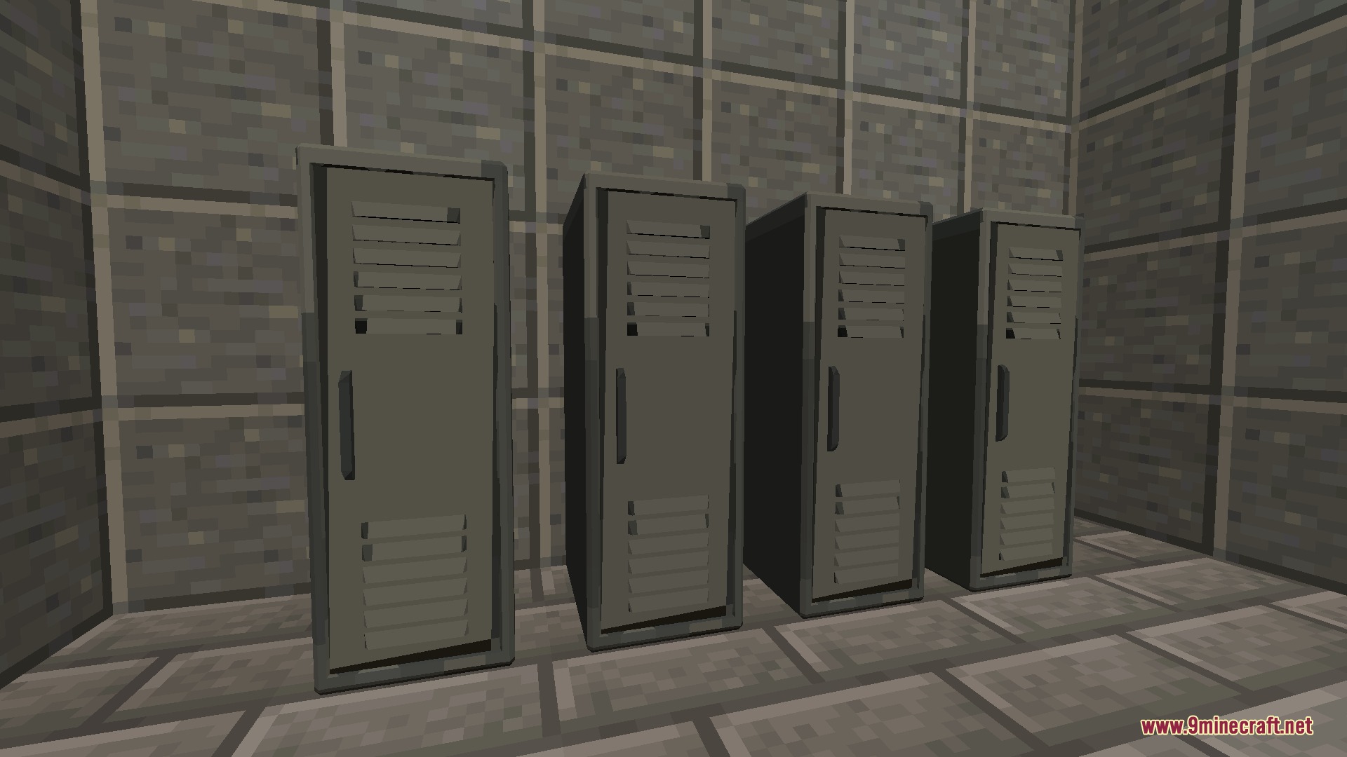 Four tall grey metal lockers standing in a row against a stone wall