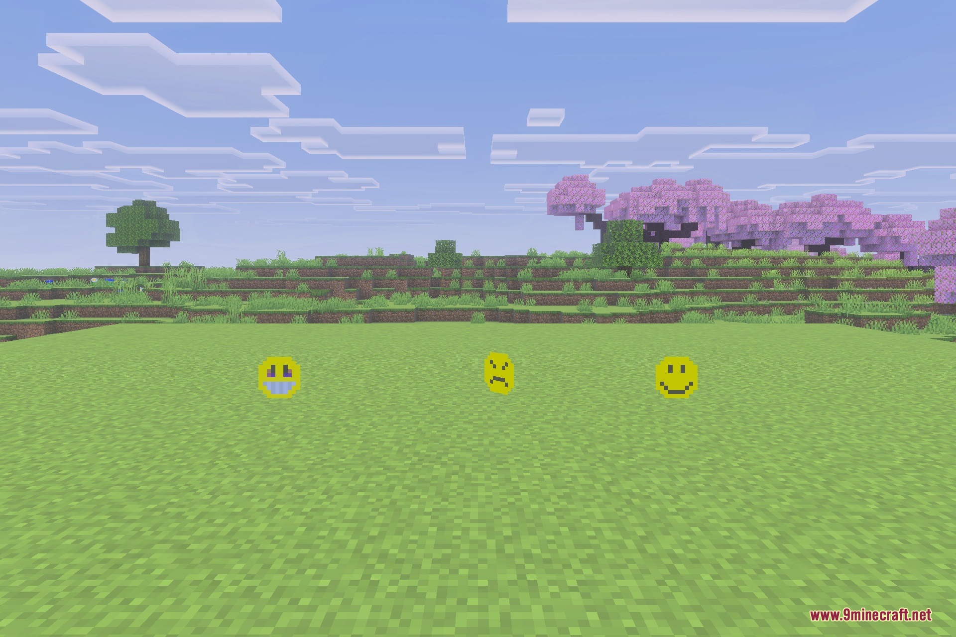 Three yellow Verity entities with different facial expressions stand in a grassy field