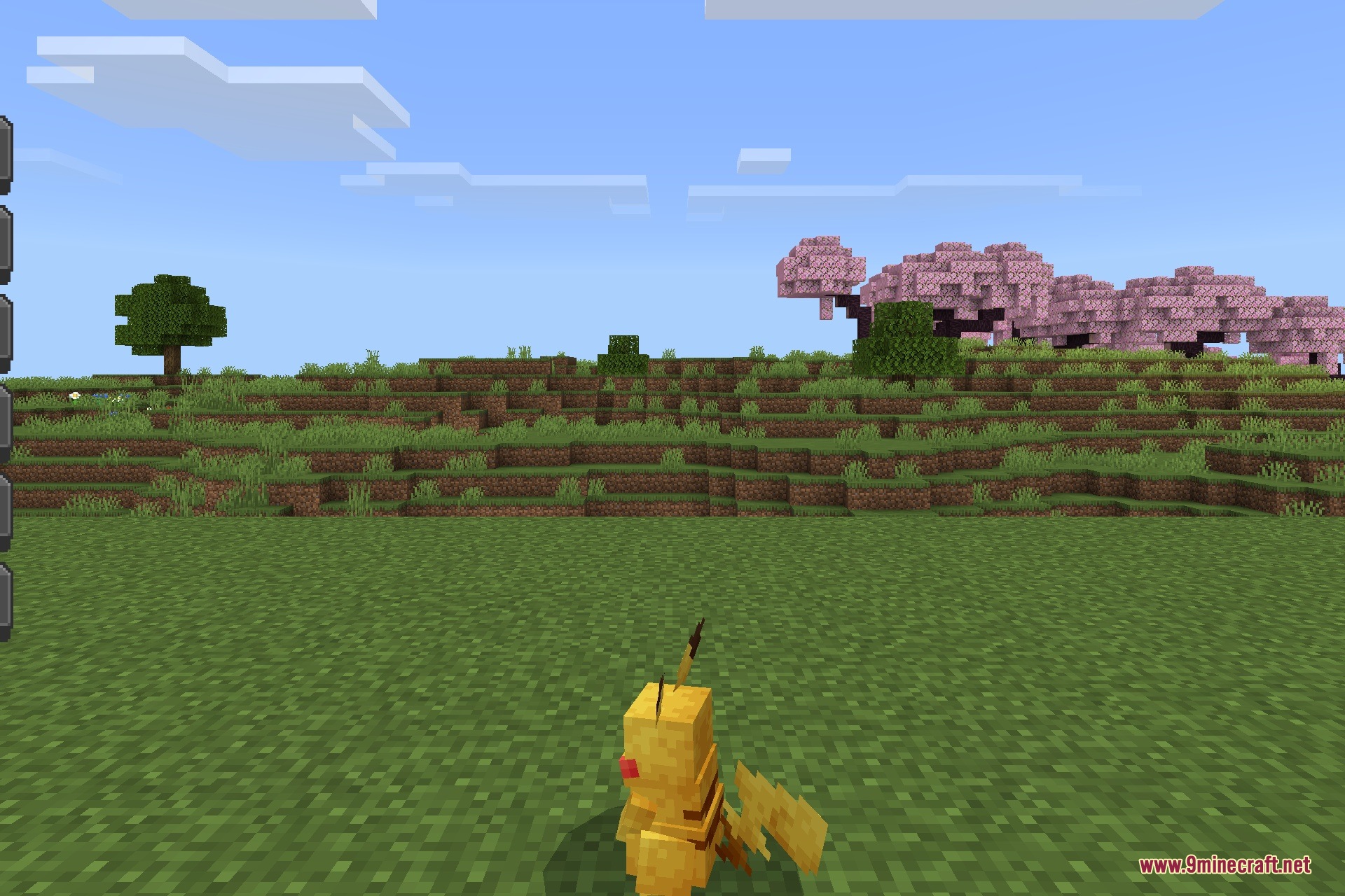 CobbleDrock 1.2.3 Gym Challenge Update Addon Screenshot 5 A yellow Pikachu mob stands in a grassy field with cherry blossom trees