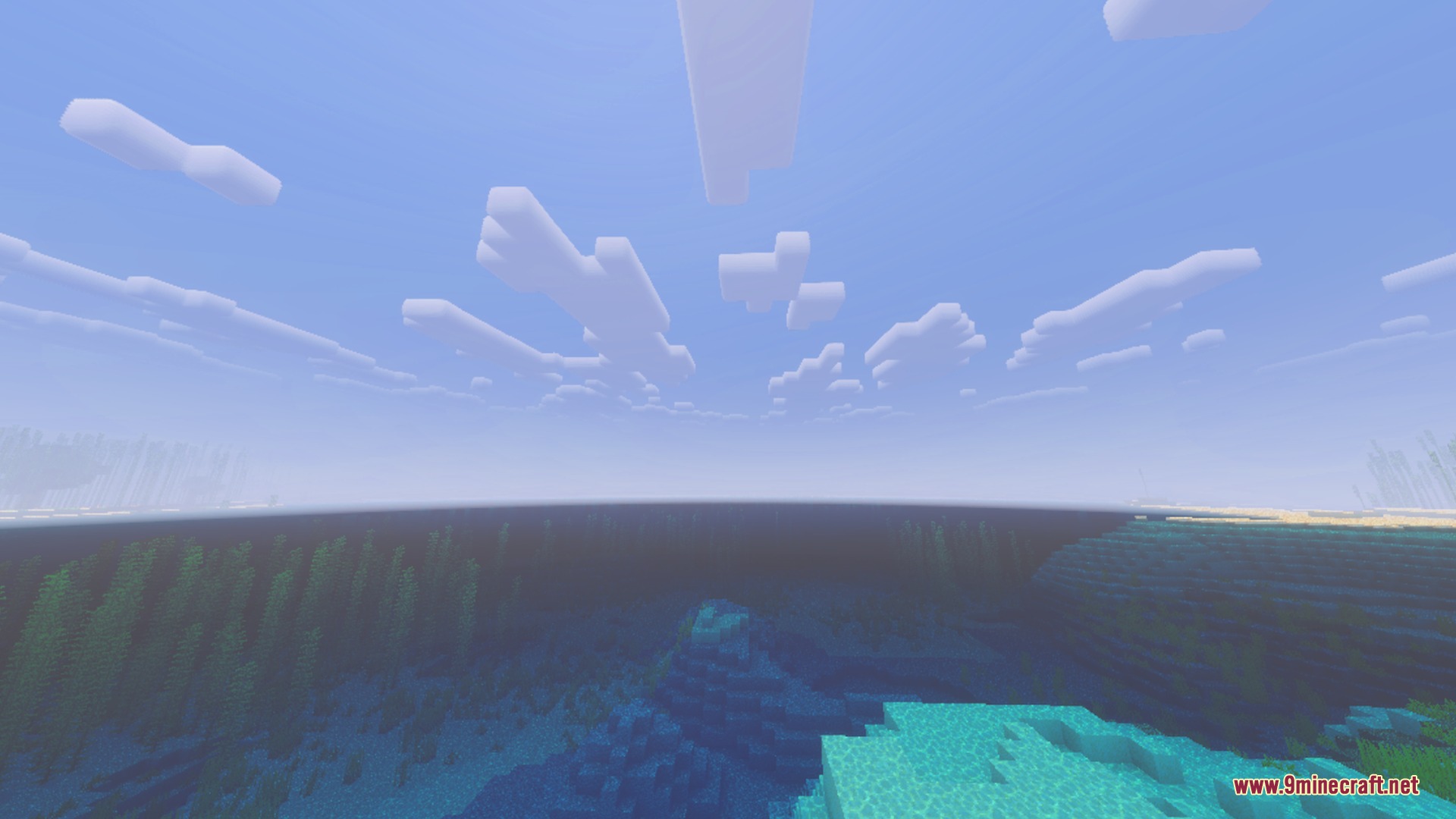 Deep blue ocean water stretching toward the horizon under blocky clouds