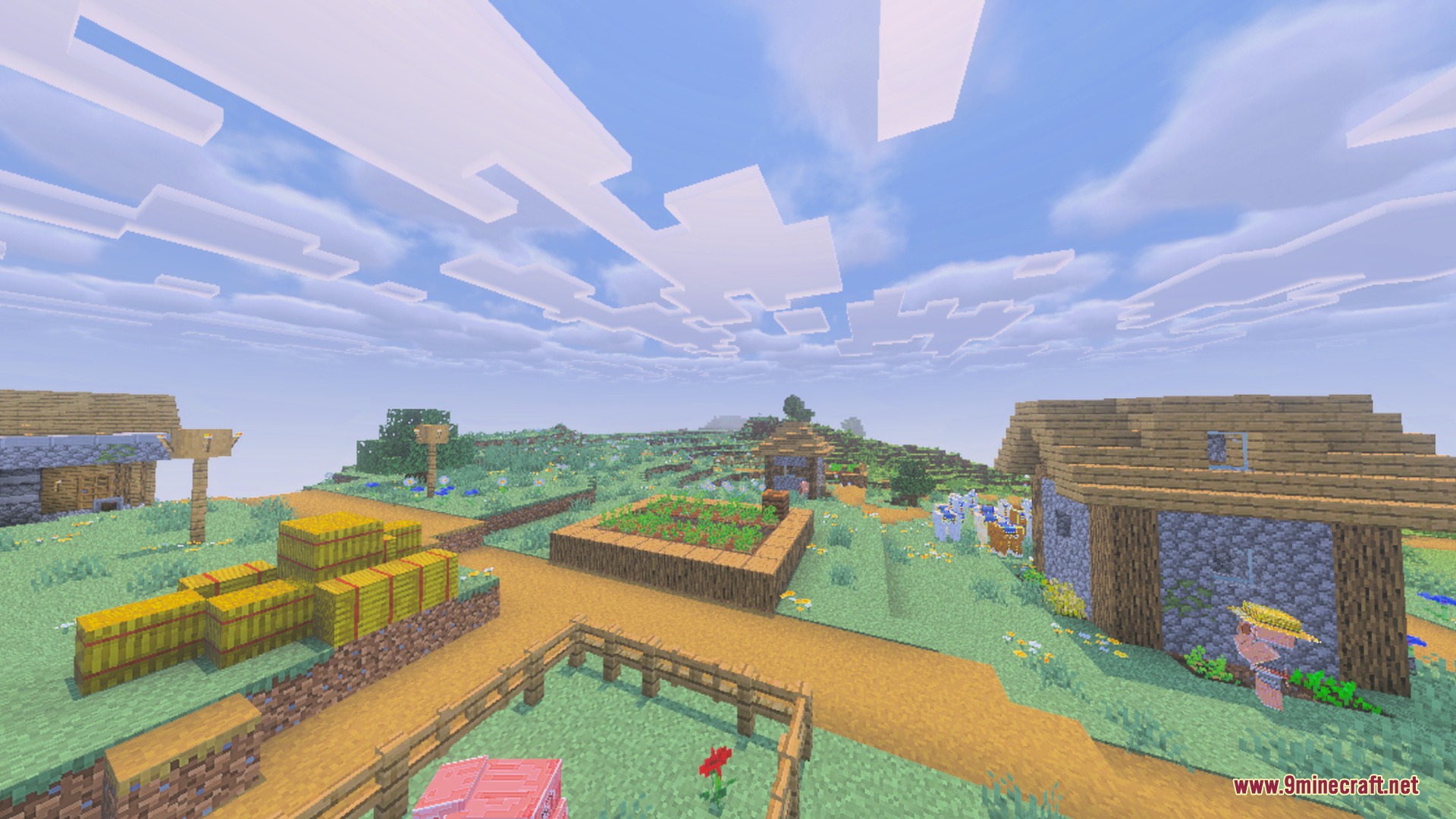 Peaceful Minecraft village under a bright blue sky with blocky white clouds