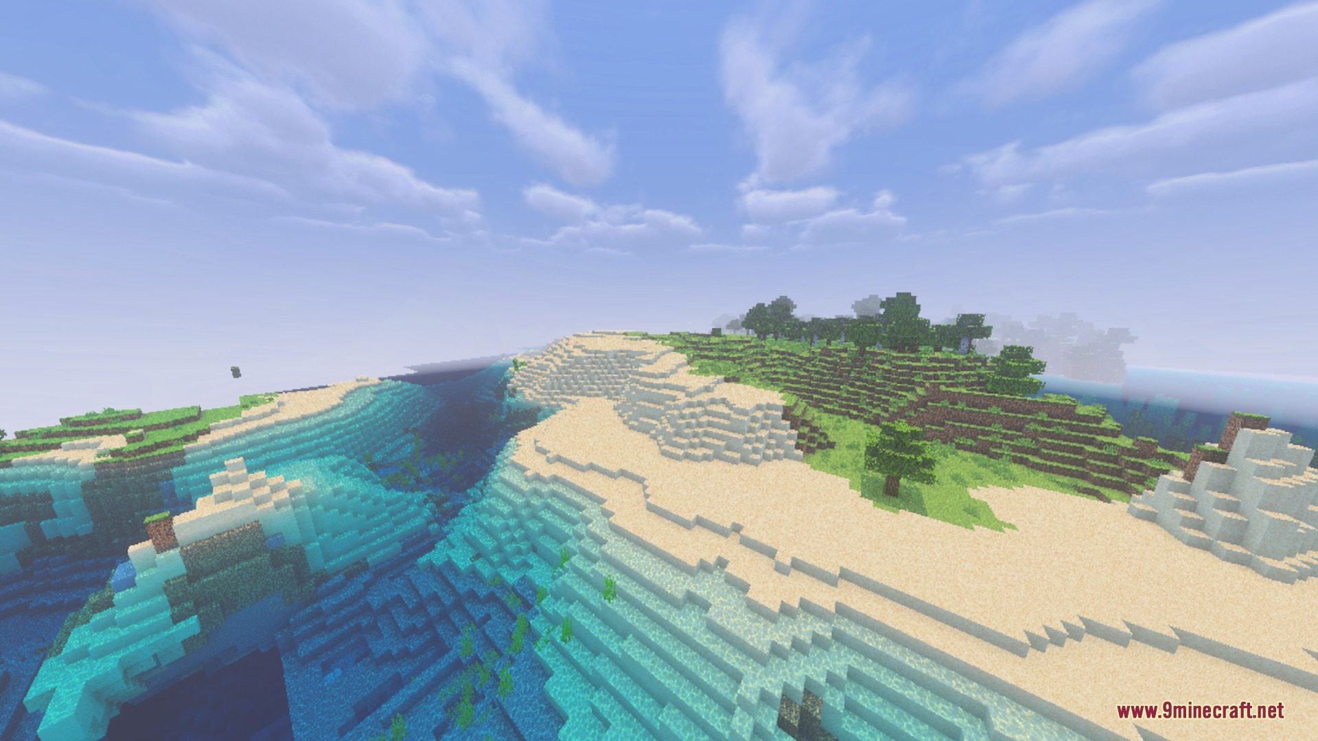 Bright beach with white sand and clear blue water under soft clouds