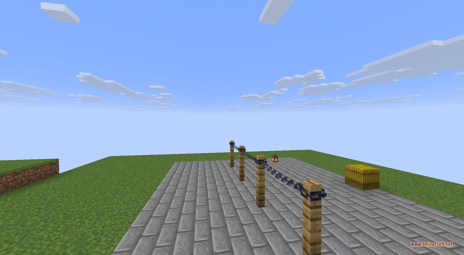 Connectible Chains 9minecraft Mod Screenshot 4 A row of wooden fence posts connected by sagging iron chains