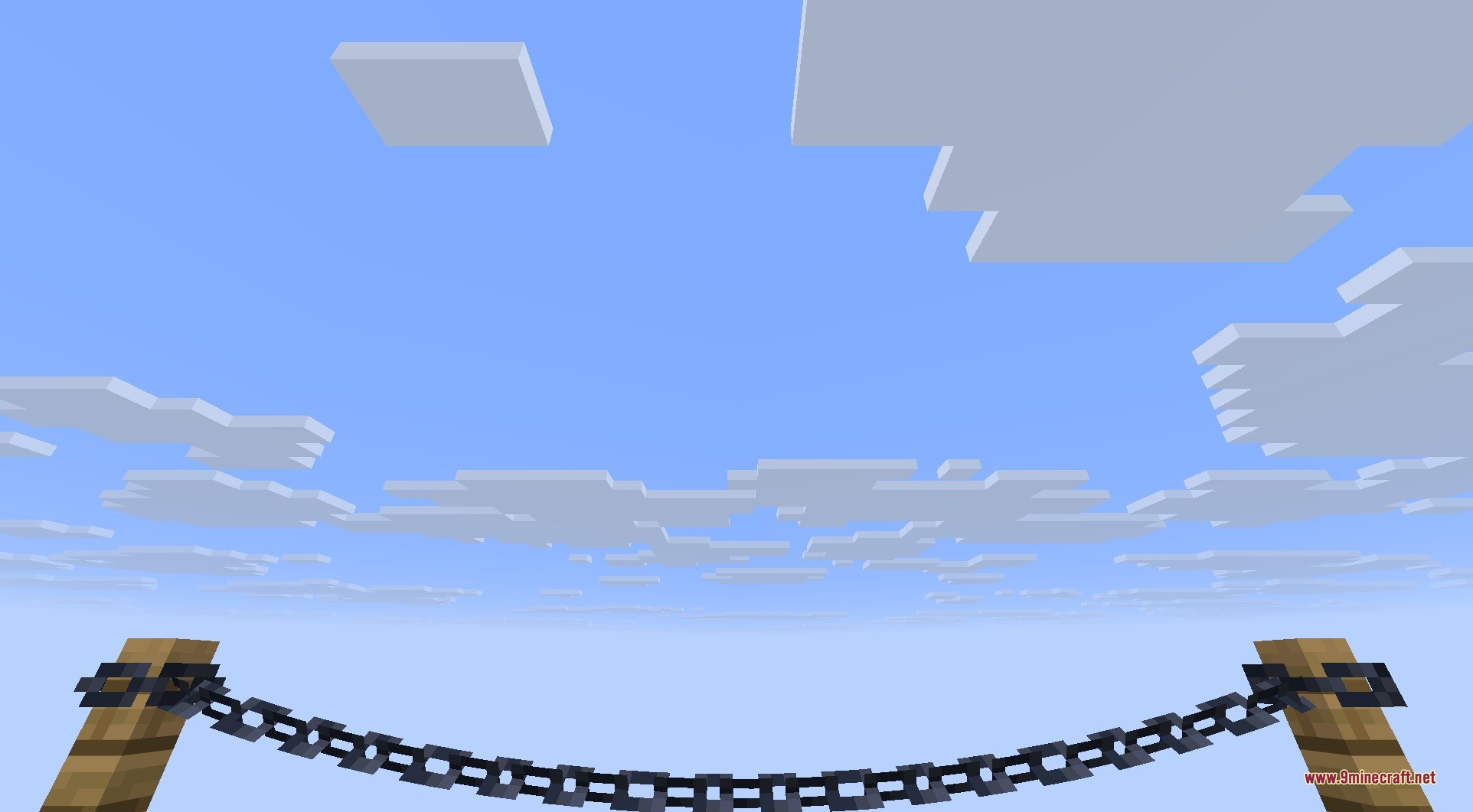 Connectible Chains 9minecraft Mod Screenshot 5 A decorative chain hanging between two wooden fence posts against a blue sky