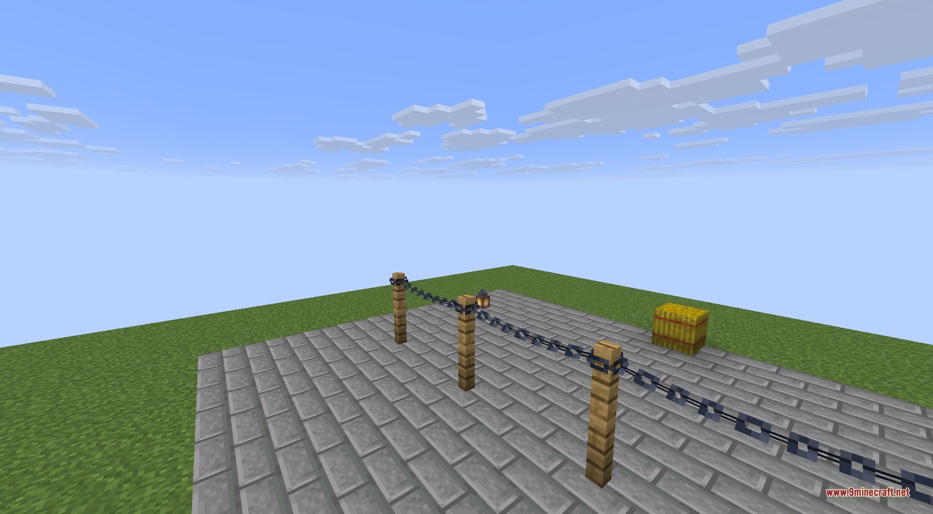 Connectible Chains 9minecraft Mod Screenshot 6 Wooden fence posts connected with sagging chains on a stone brick floor in Minecraft