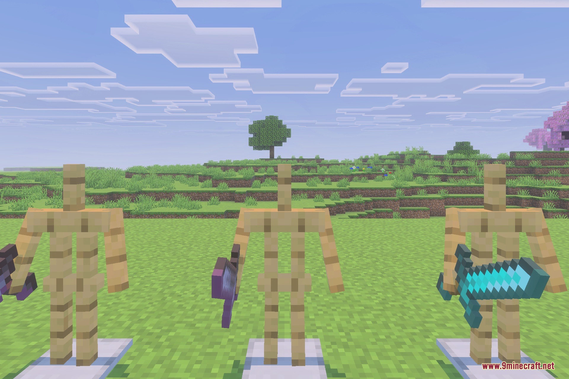 Three armor stands displaying custom overpowered weapons and a standard diamond sword